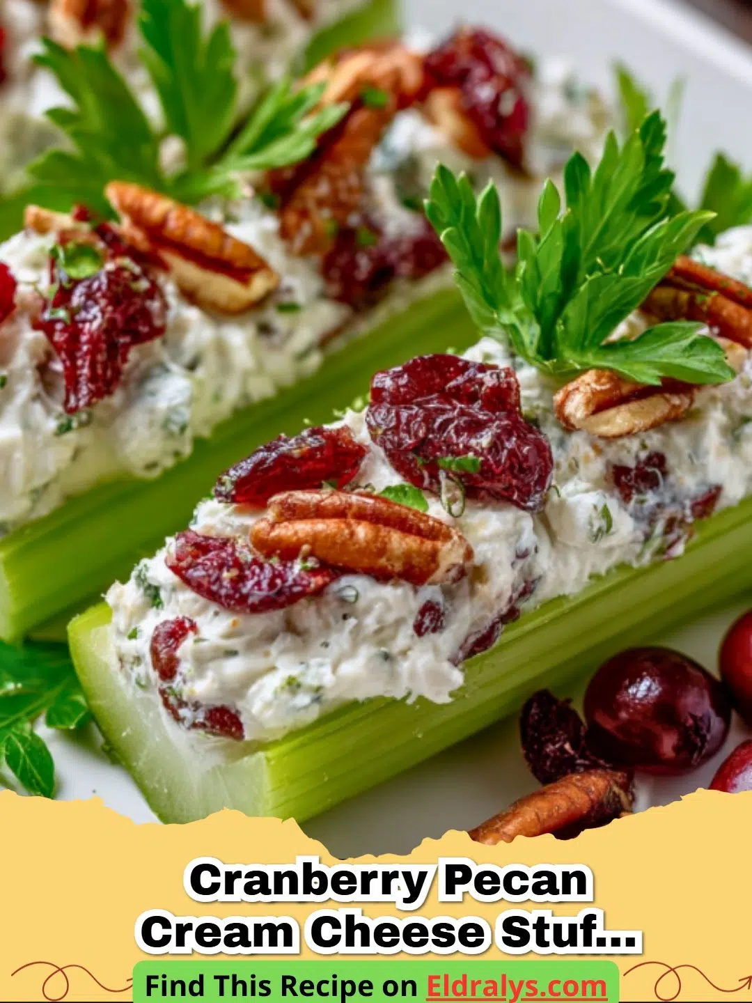 Festive Cranberry Pecan Cream Cheese Stuffed Celery “Snow Logs" on a wooden platter.