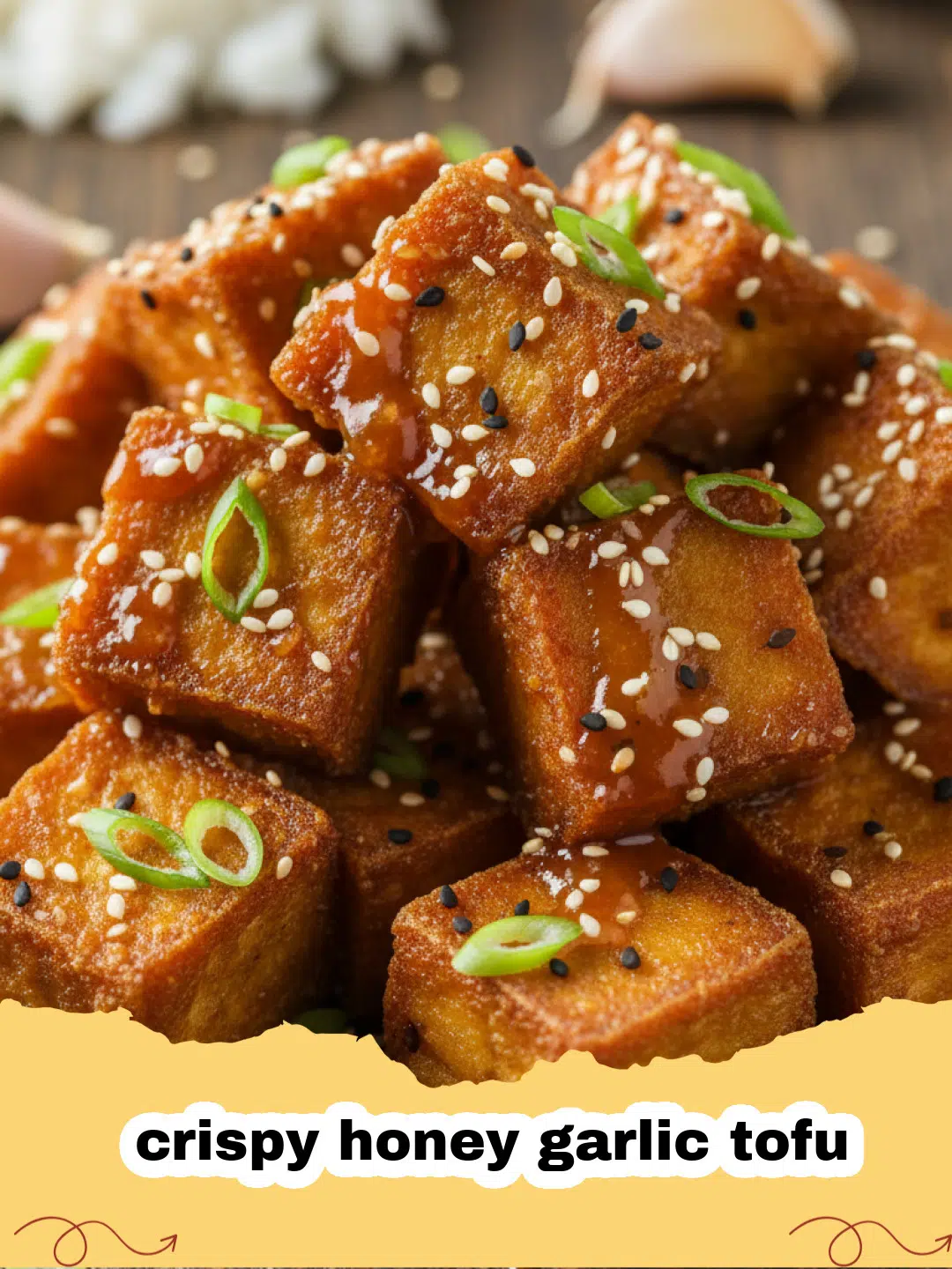 Close-up of crispy honey garlic tofu garnished with sesame seeds and green onions.