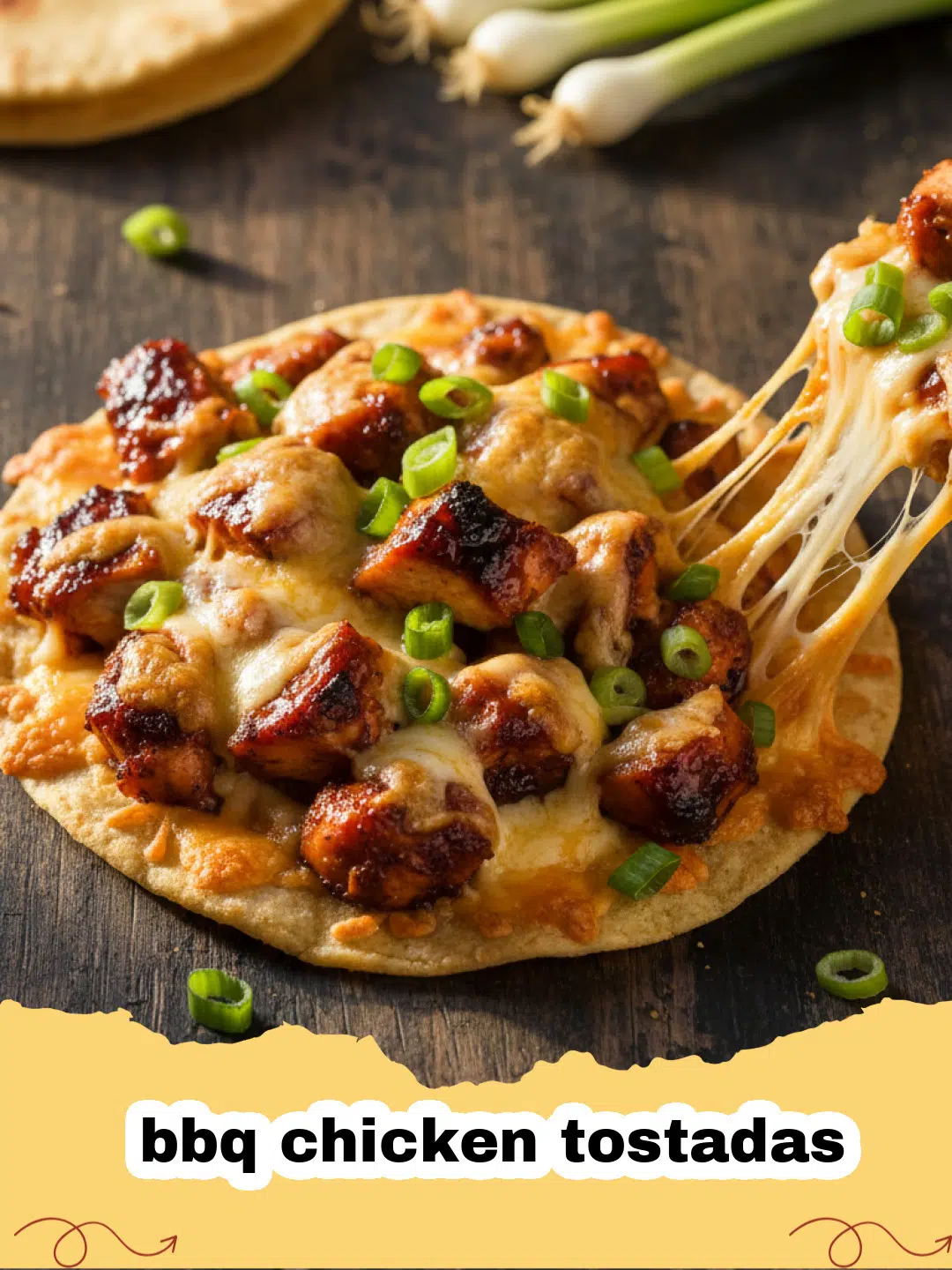 bbq chicken tostadas - Close-up of crispy BBQ Chicken Tostadas piled high with shredded chicken, cheese, red onion, cilantro, and avocado.