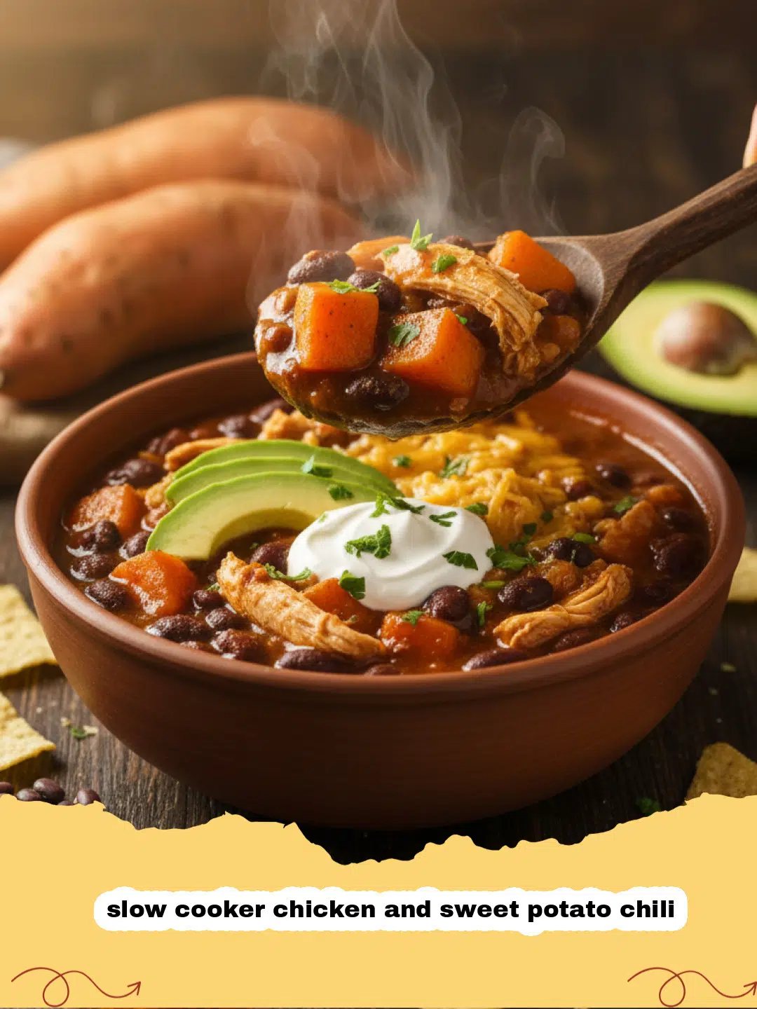 slow cooker chicken and sweet potato chili - A bowl of Slow Cooker Chicken and Sweet Potato Chili topped with sour cream, cilantro, and shredded cheese.