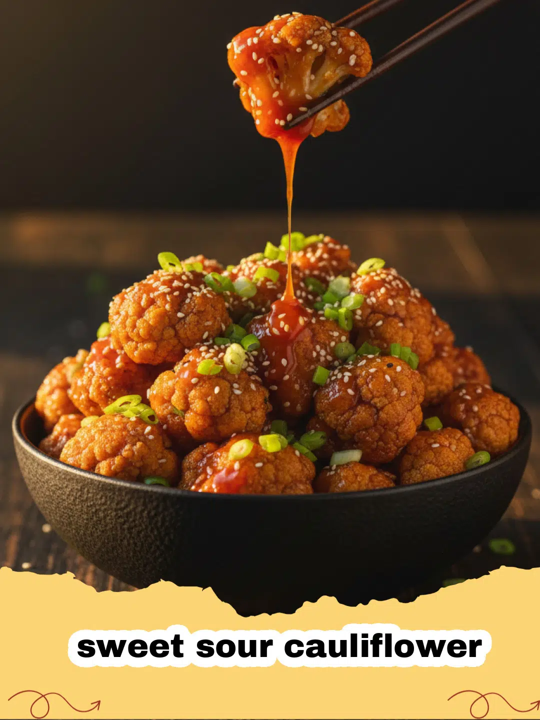 Close-up of vibrant sweet sour cauliflower with pineapple chunks, garnished with green onions and sesame seeds.