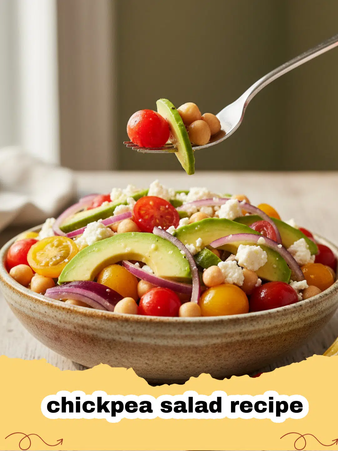 chickpea salad recipe - Close-up of a bowl of creamy chickpea salad garnished with fresh dill and a lemon wedge, ready to be served.