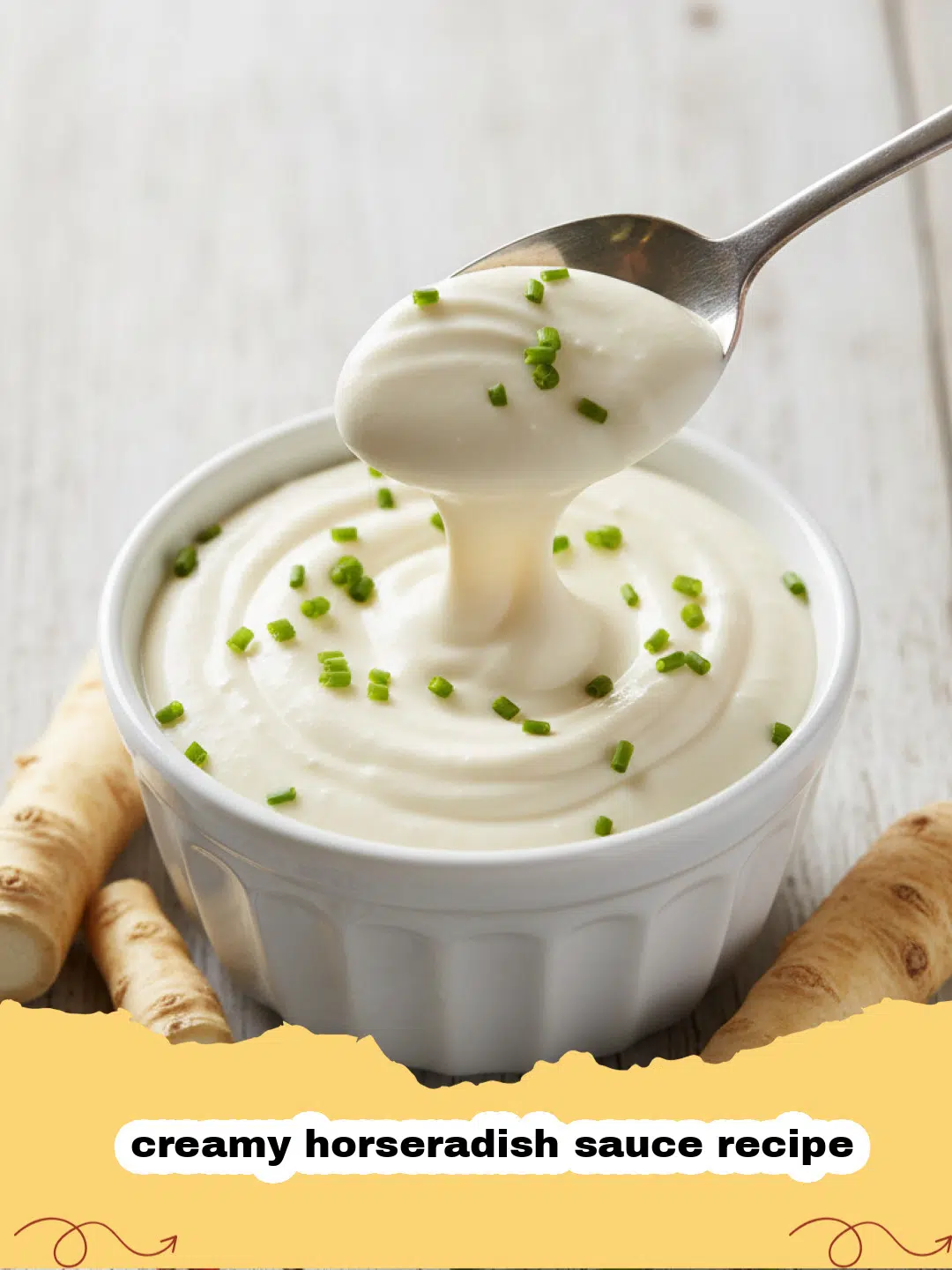 creamy horseradish sauce recipe - A bowl of creamy white horseradish sauce with a spoon, garnished with fresh dill, next to a piece of roast beef.