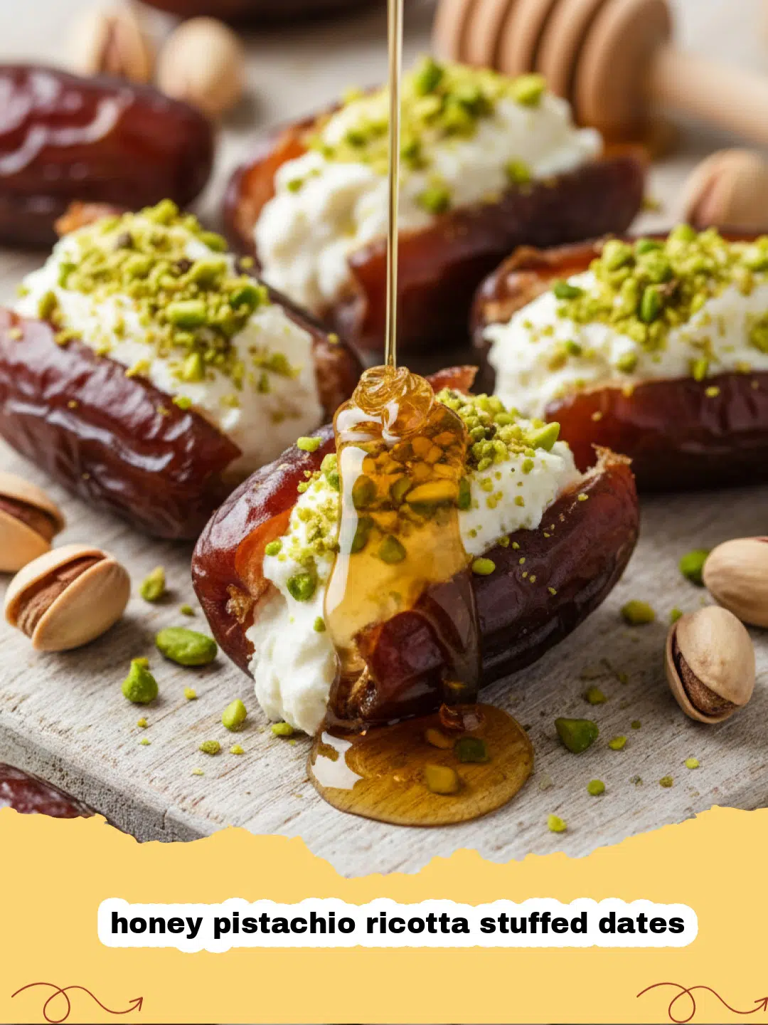 Close-up of honey pistachio ricotta stuffed dates on a white plate, garnished with fresh mint.