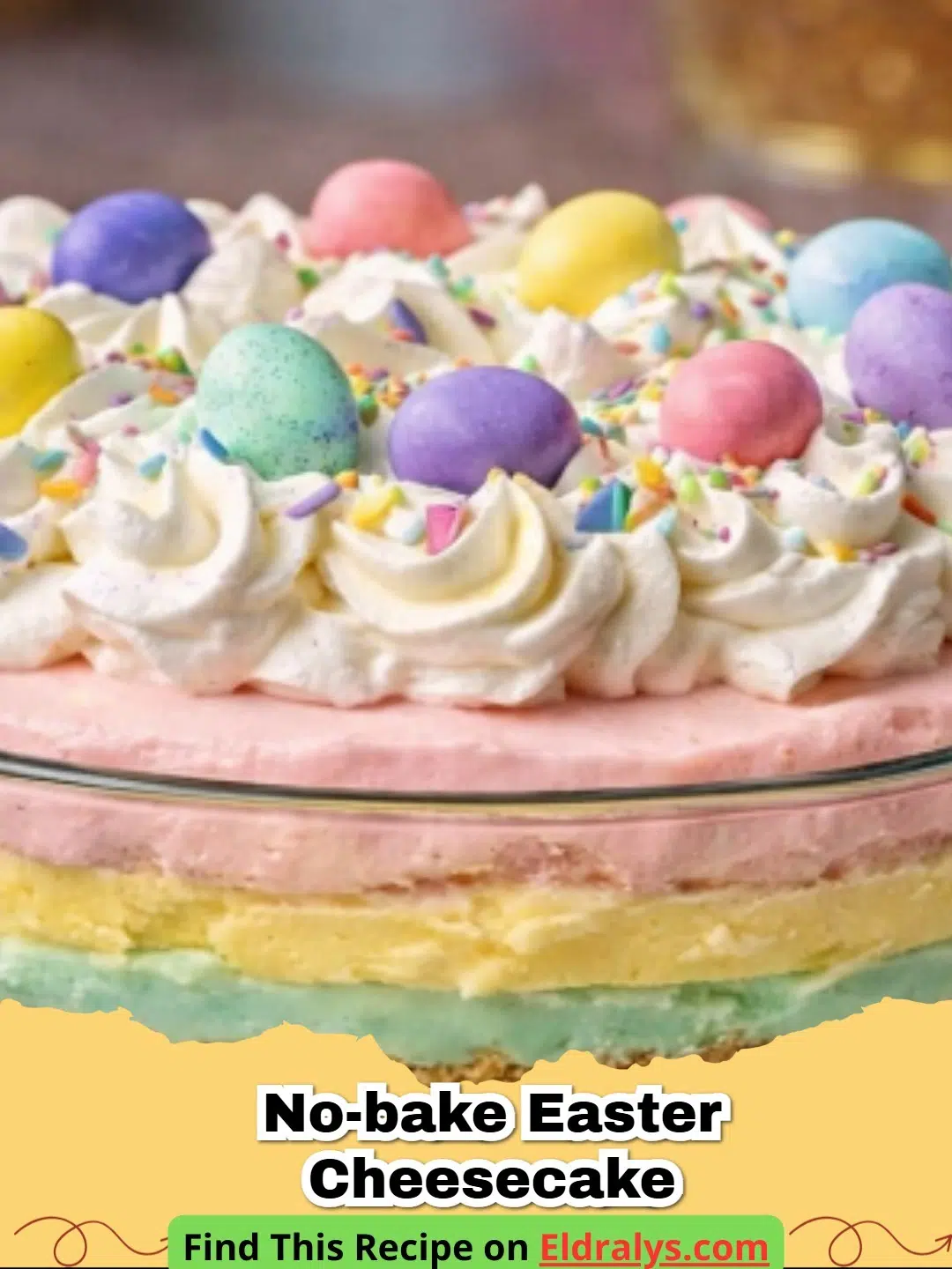 A vibrant No-Bake Pastel Easter Cheesecake with pink, yellow, and blue layers topped with candy eggs.