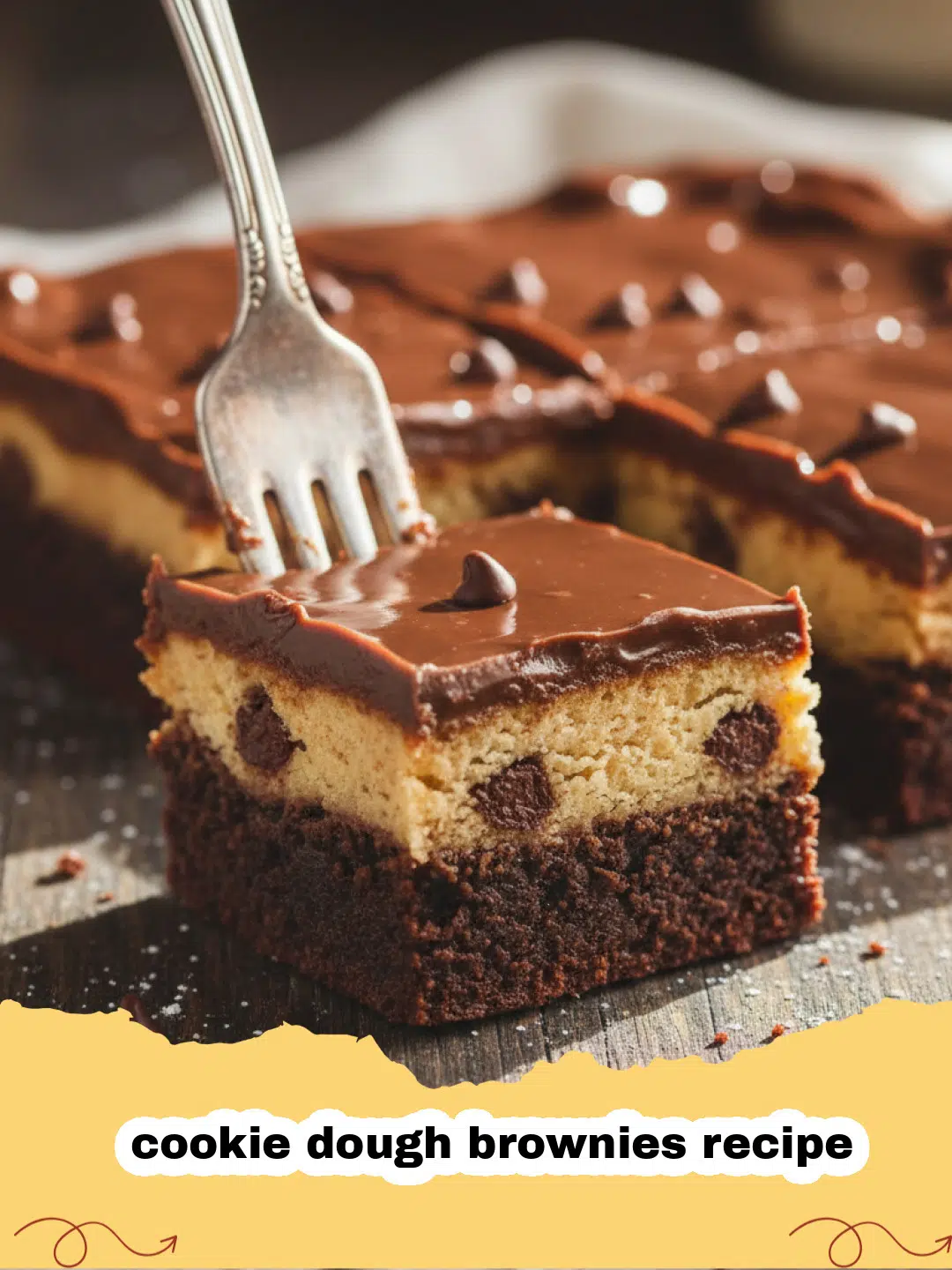 cookie dough brownies recipe - Close-up of a stack of cookie dough brownies with a bite taken out, showing the distinct layers.