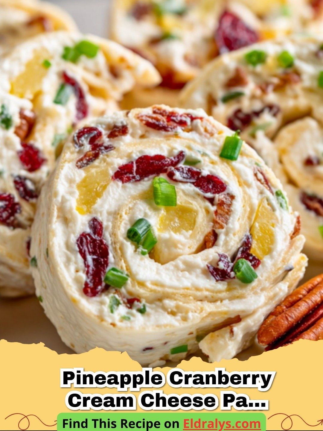 A close up shot of Pineapple Cranberry Cream Cheese Party Pinwheels arranged on a serving plate.