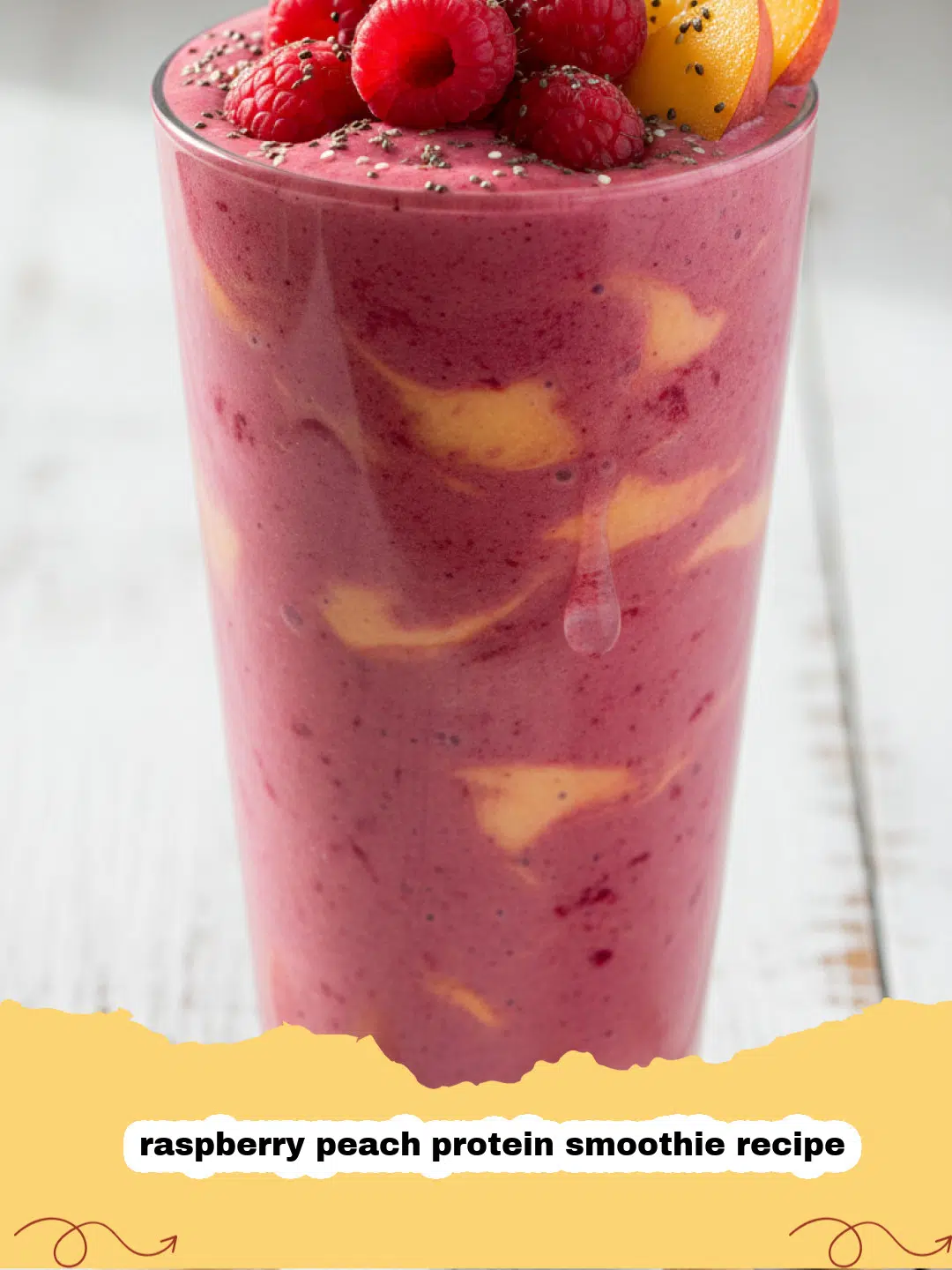 raspberry peach protein smoothie recipe - Vibrant raspberry peach protein smoothie in a glass with fresh fruit garnish