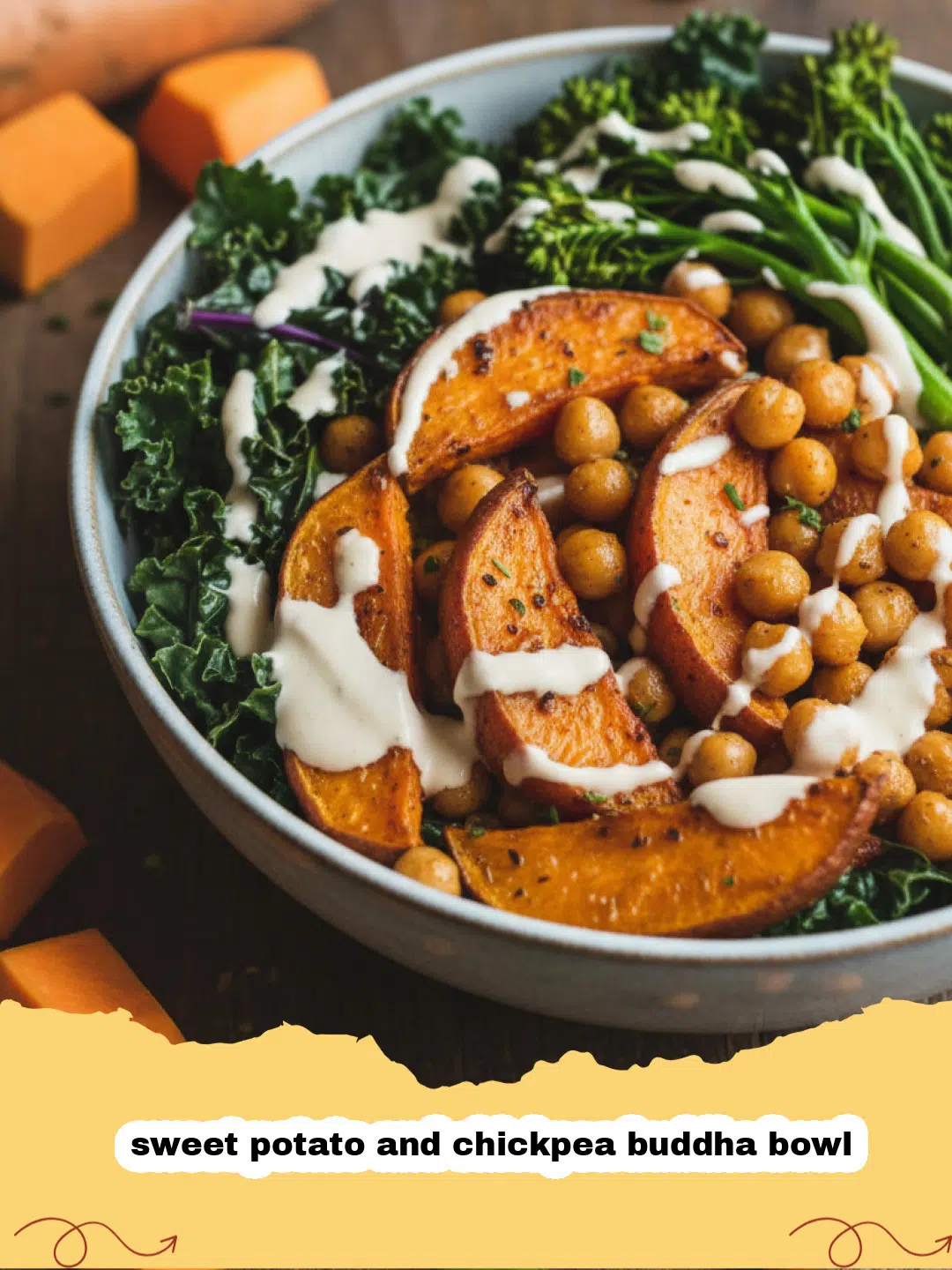 A vibrant sweet potato and chickpea buddha bowl with kale and tahini dressing.