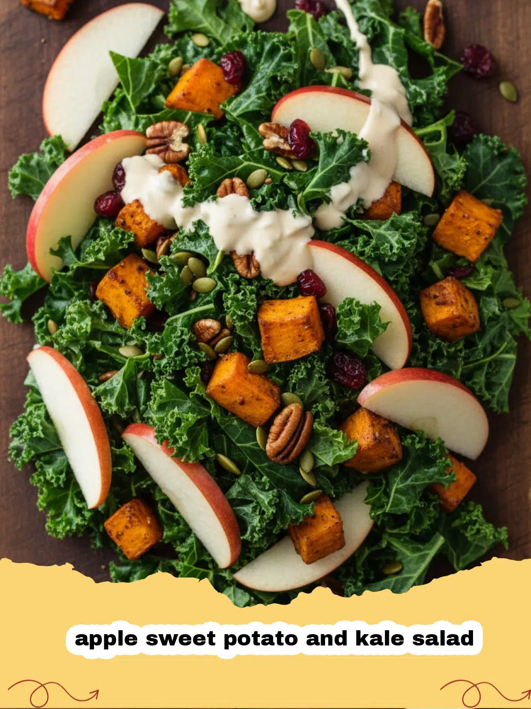 A large bowl of apple sweet potato and kale salad with roasted vegetables and fresh fruit.