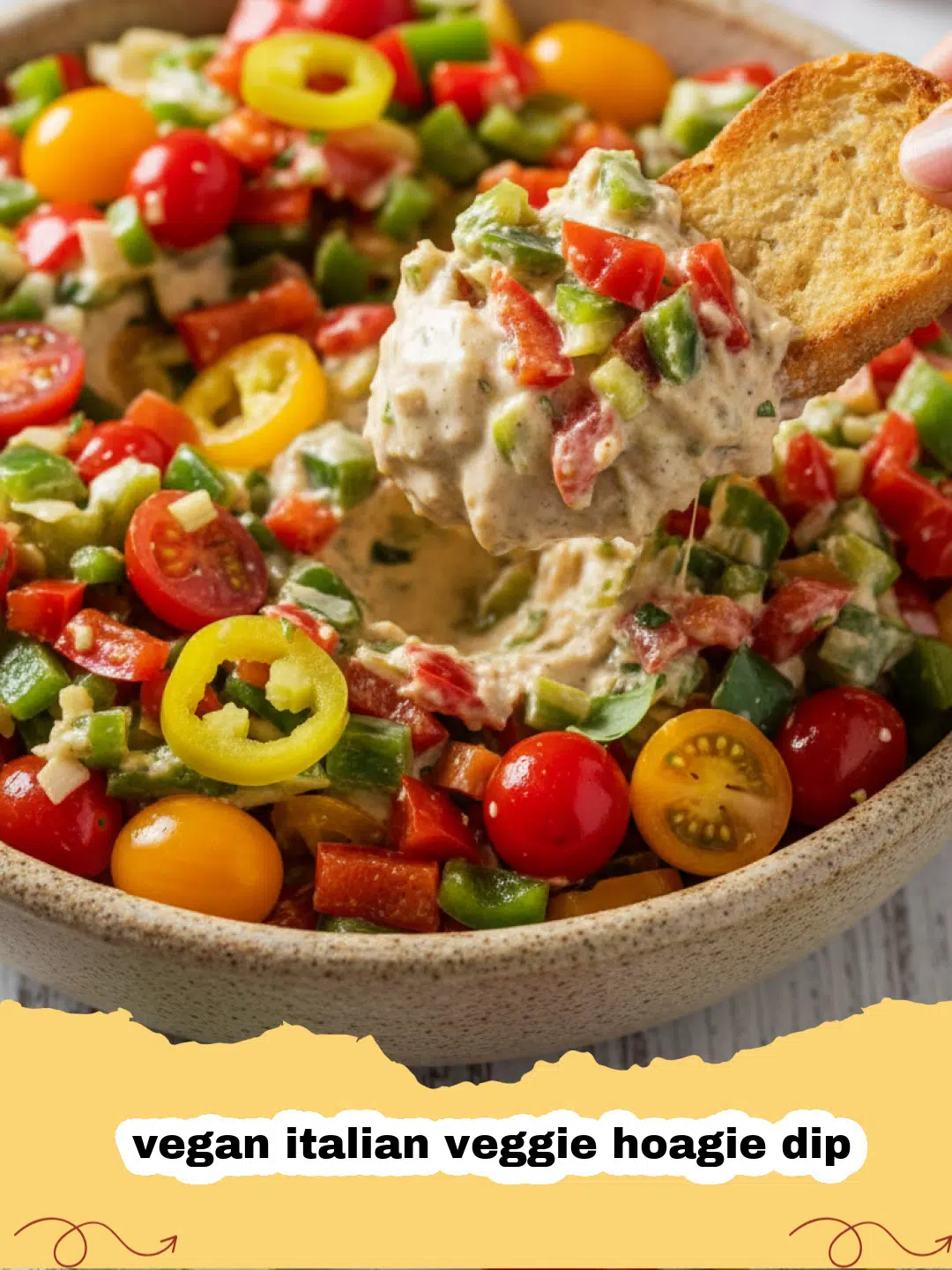 vegan italian veggie hoagie dip - A colorful layered vegan Italian veggie hoagie dip in a glass dish, garnished with fresh herbs, served with crusty bread and vegetable sticks.