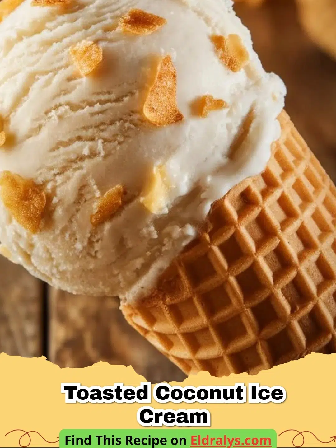A scoop of creamy Toasted Coconut Ice Cream topped with golden coconut flakes
