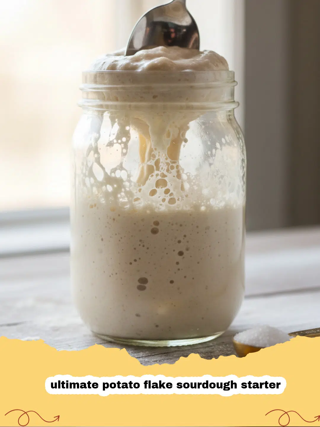 ultimate potato flake sourdough starter - A bubbly, active potato flake sourdough starter in a glass jar, demonstrating its robust activity.