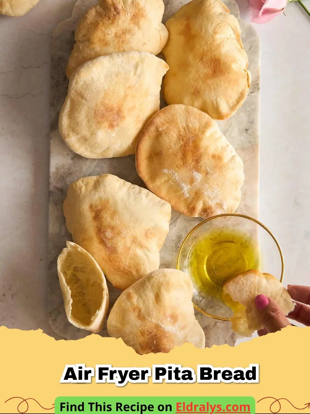 Golden brown and puffed Air Fryer Pita Bread stacked on a wooden board.