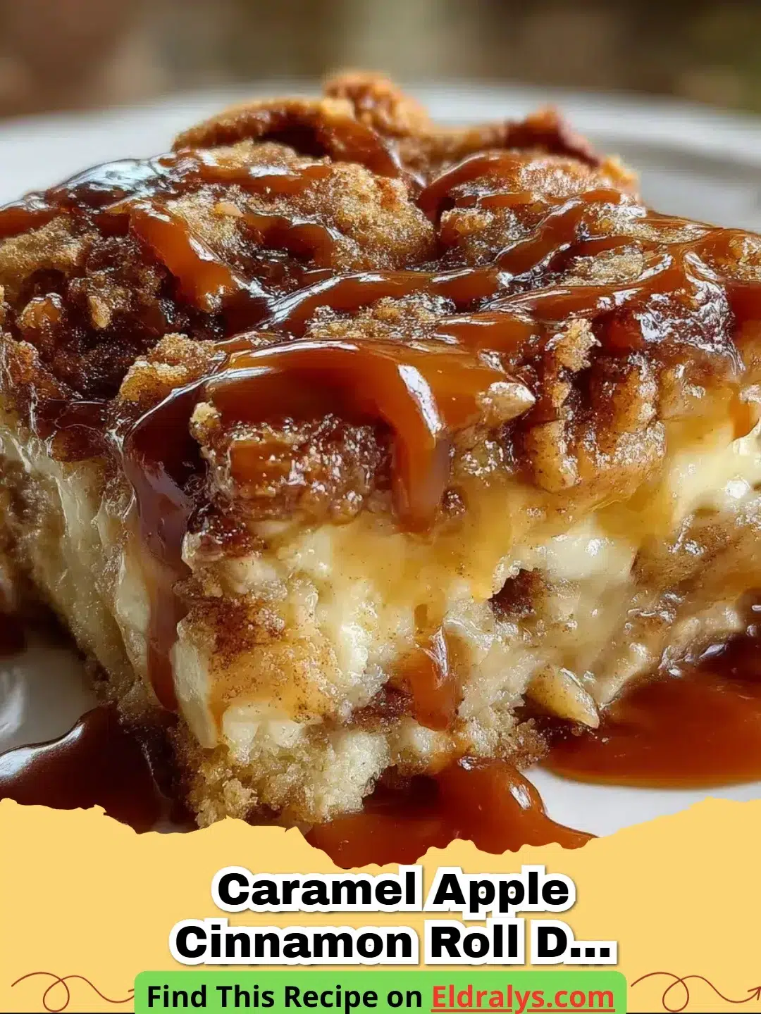 A close-up of a warm Caramel Apple Cinnamon Roll Dump Cake with melting icing and bubbling apples.