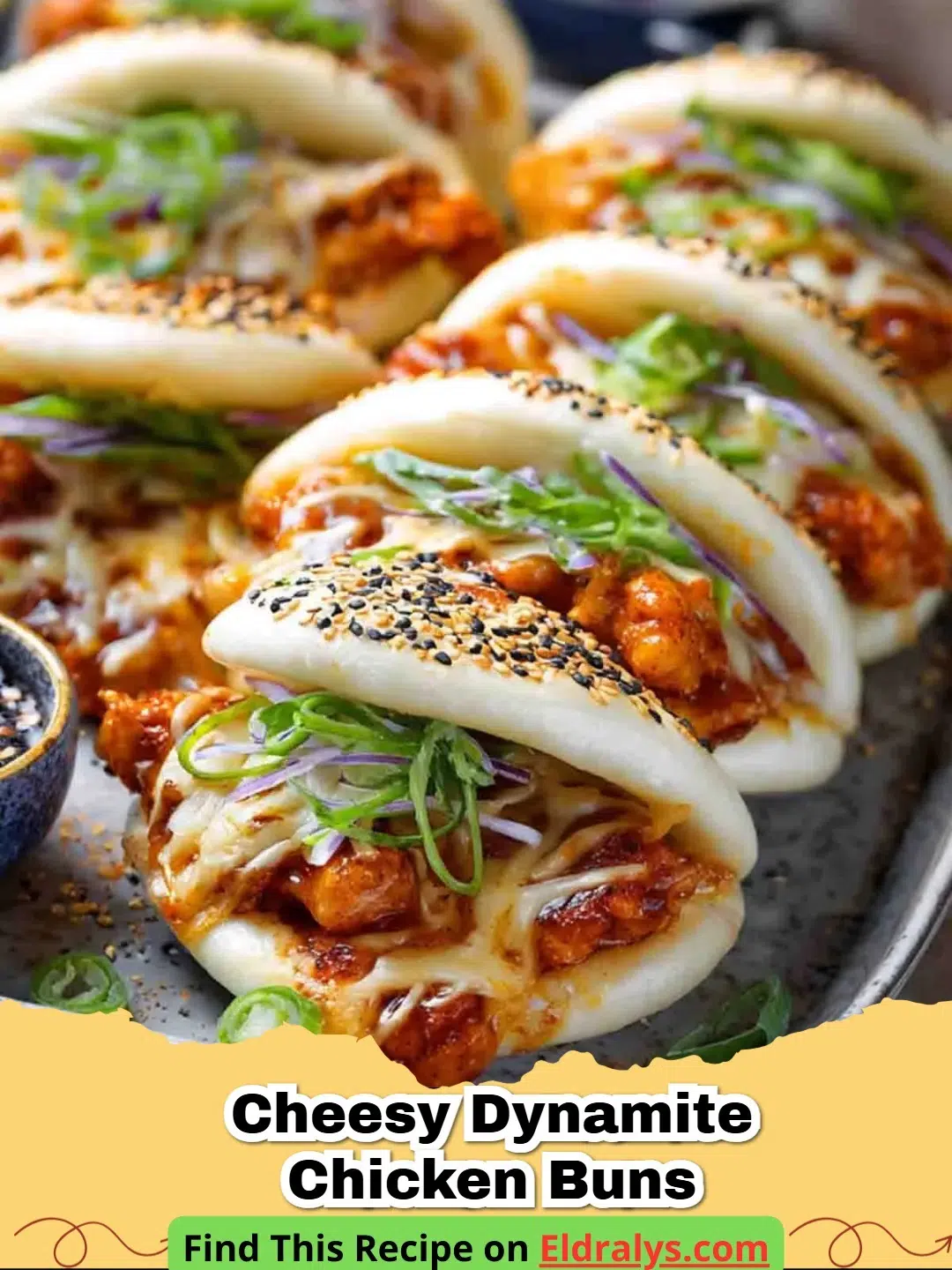 A close-up shot of golden brown Cheesy Dynamite Chicken Buns with melted cheese oozing out of one.