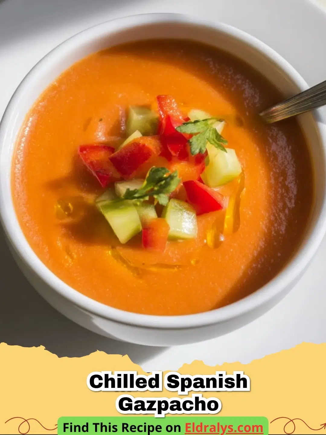 A bowl of vibrant Chilled Spanish Gazpacho garnished with olive oil and cucumber.