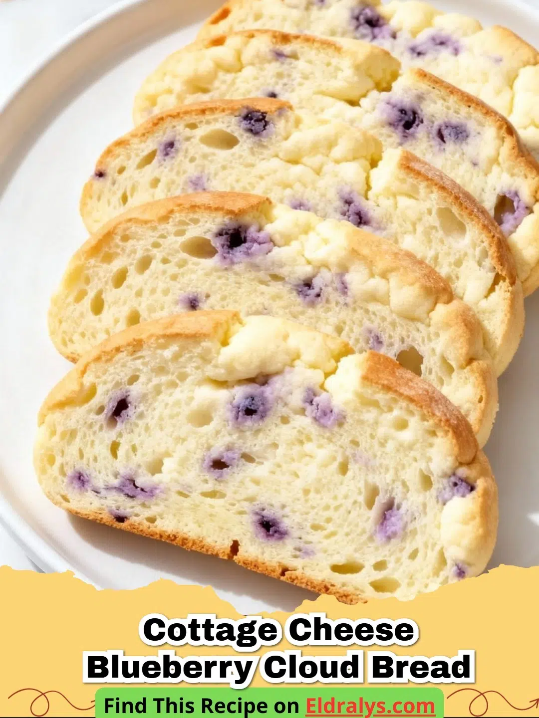A close up photo of golden Cottage Cheese Blueberry Cloud Bread on a baking sheet.