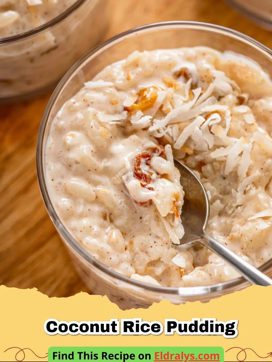 A bowl of creamy Coconut Rice Pudding topped with toasted coconut and mango.