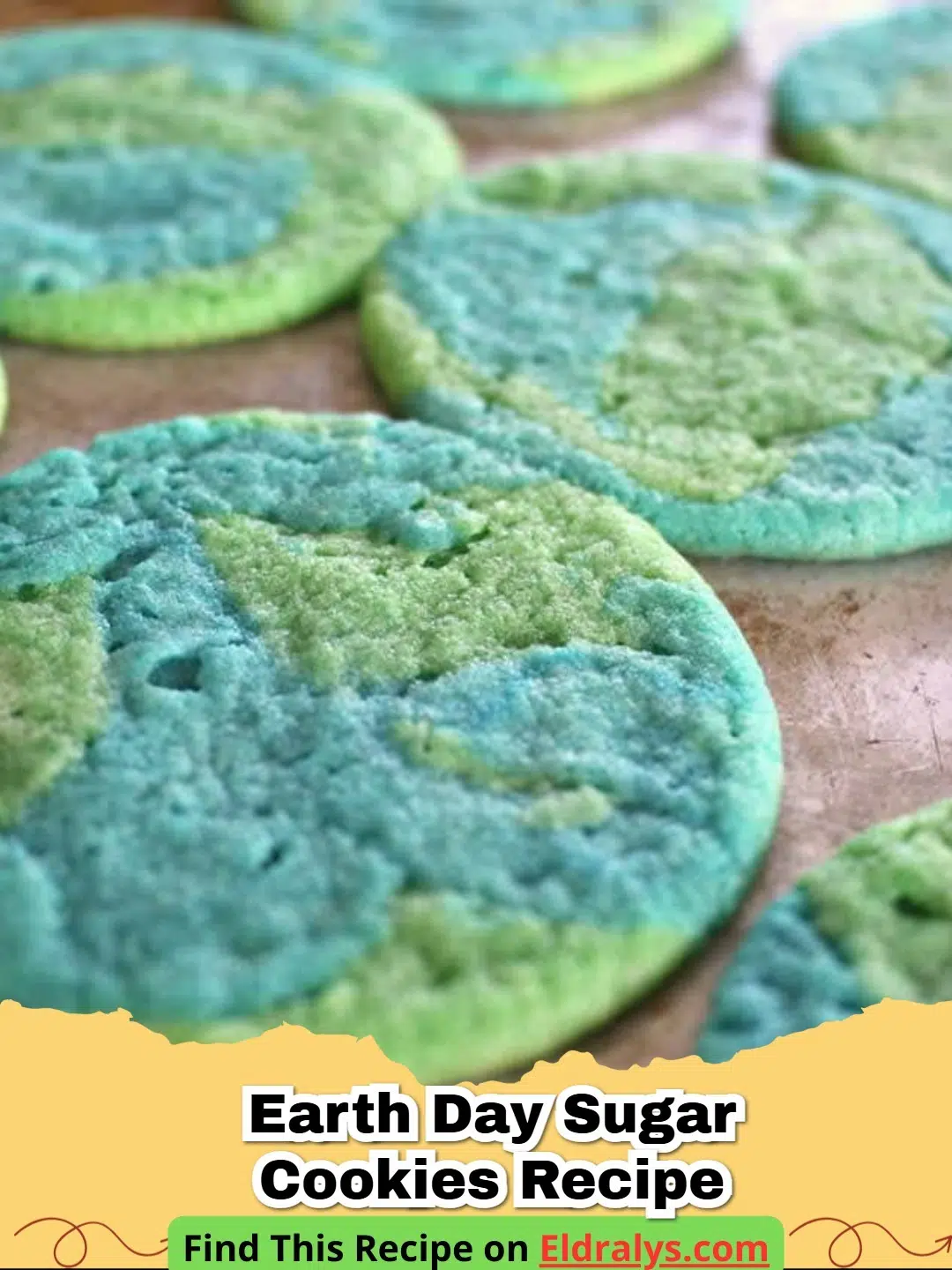 Beautiful blue and green marbled Earth Day Sugar Cookies Recipe on a white plate.