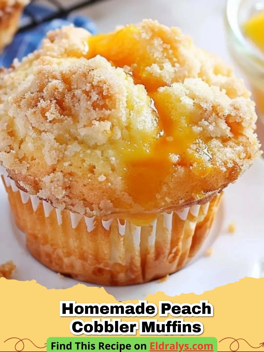 A close up photo of Easy Peach Cobbler Muffins with Streusel Topping on a wooden board.