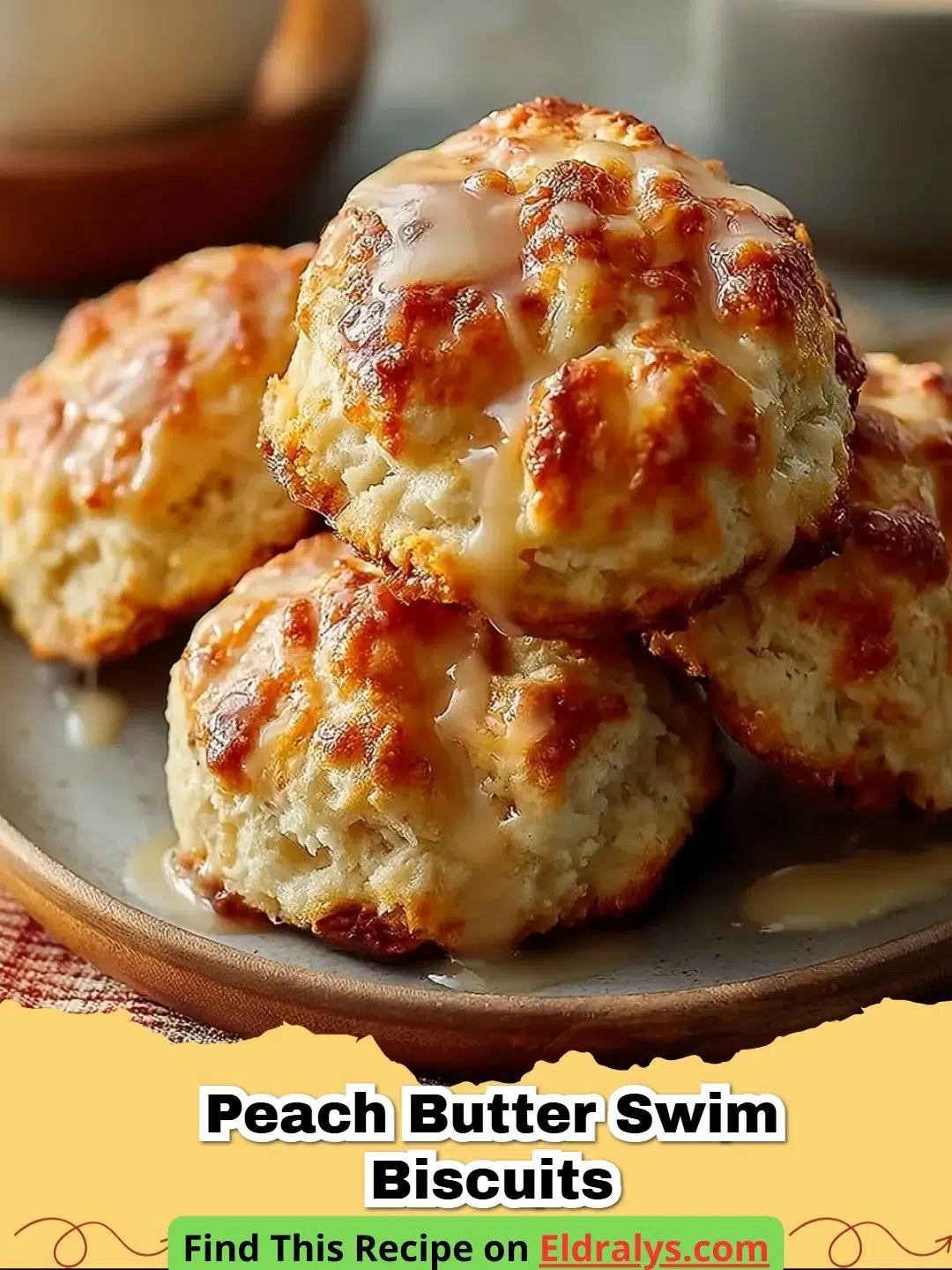 Golden brown Peach Butter Swim Biscuits in a square baking dish with vanilla glaze.