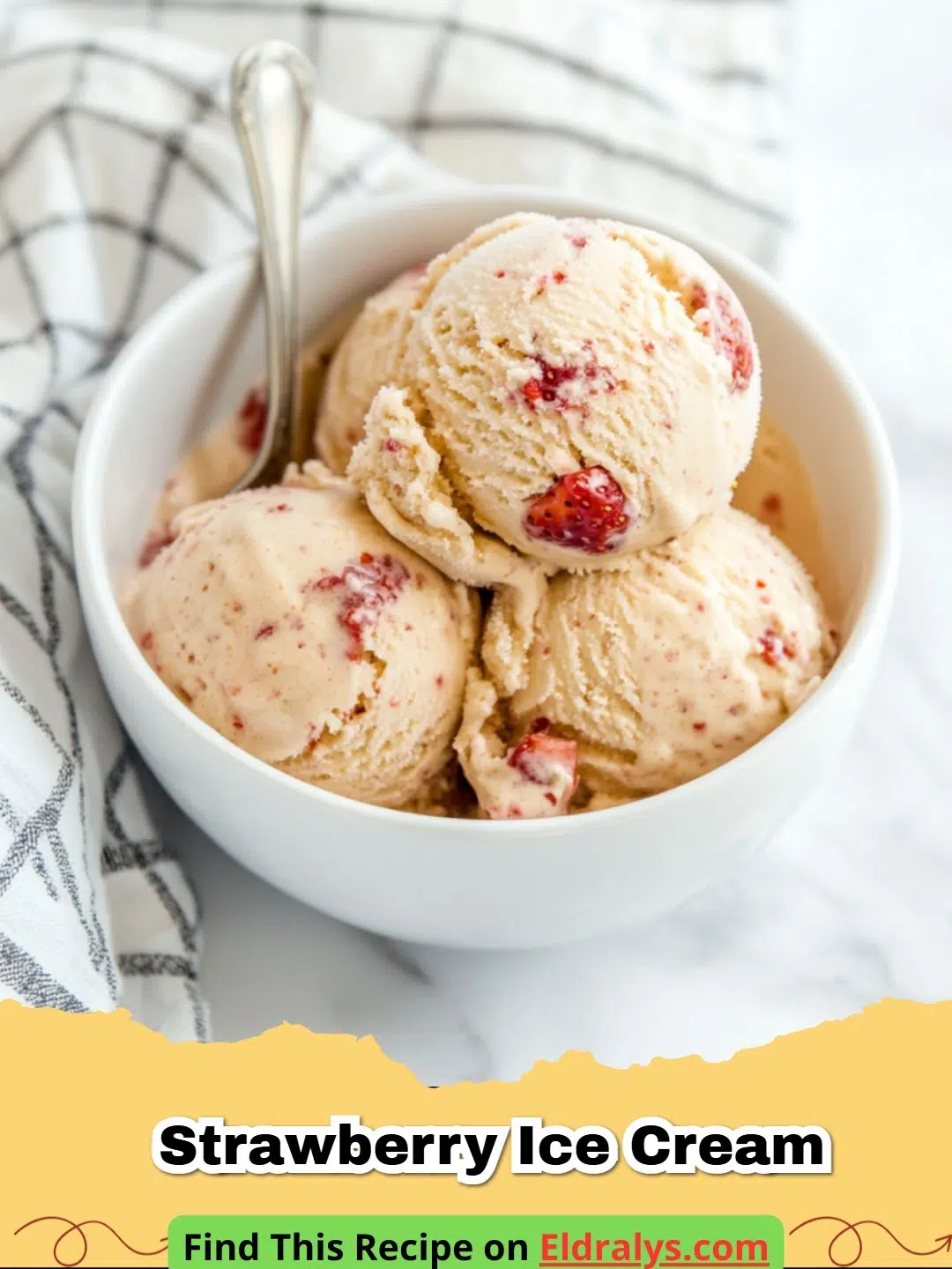 A close-up scoop of pink Strawberry Ice Cream in a white bowl with fresh berries on the side.