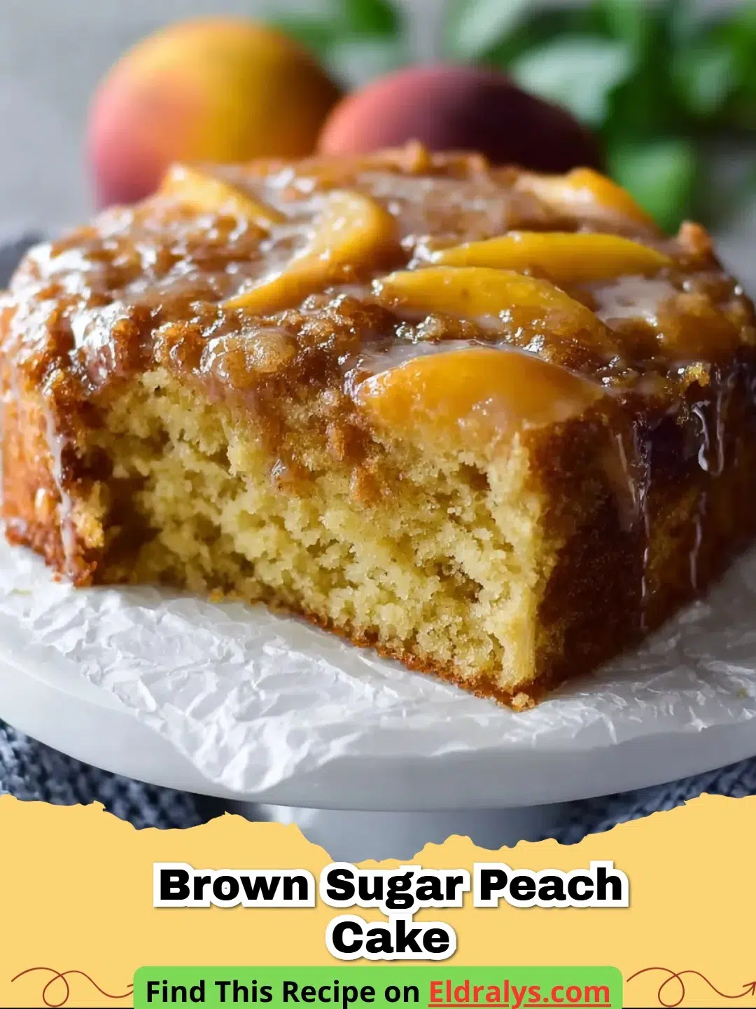 A close up of a sliced Brown Sugar Peach Cake on a cooling rack with fresh peaches nearby.