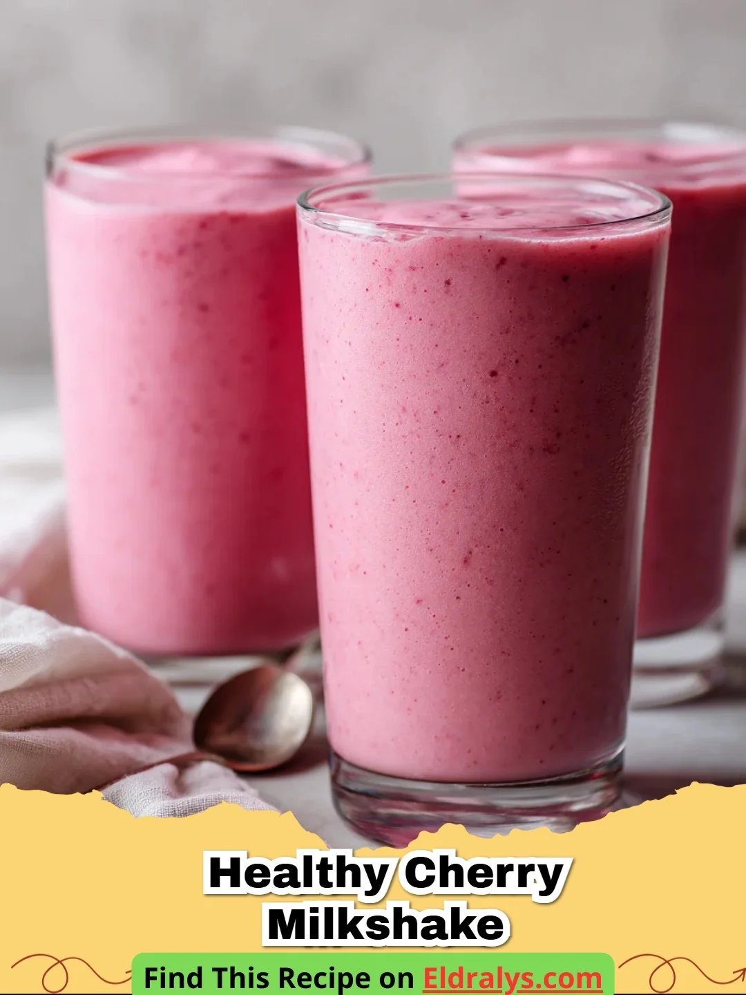 Healthy Cherry Milkshake Recipe - A vibrant pink healthy cherry milkshake in a tall glass with a straw.
