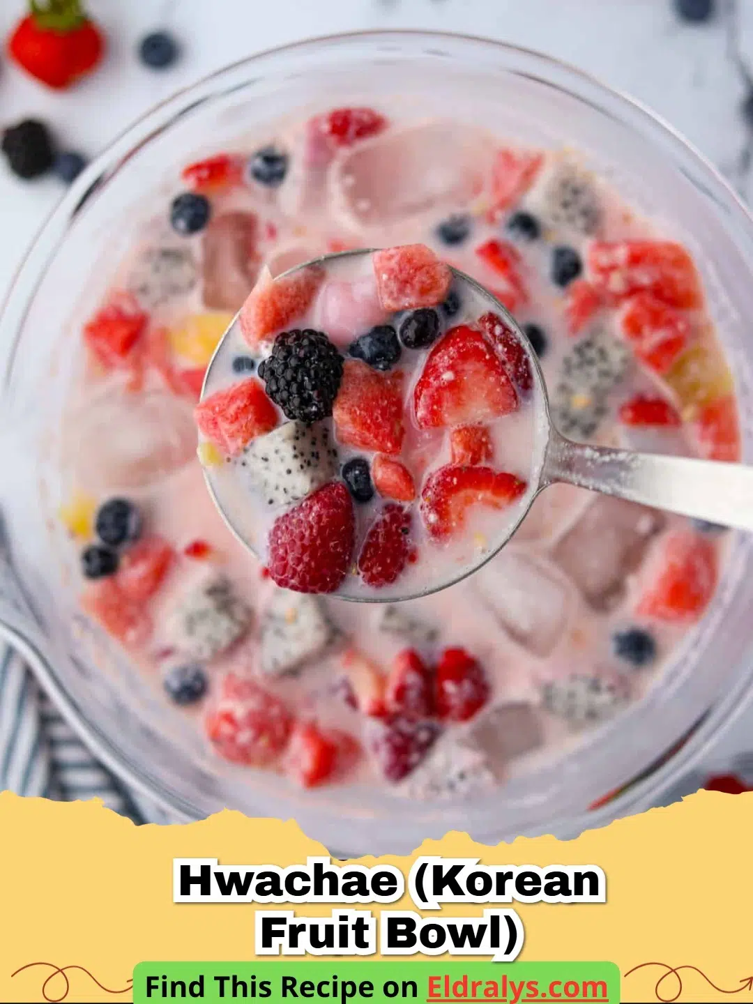 A colorful Hwachae (Korean Fruit Bowl) filled with watermelon and berries in a milky base.