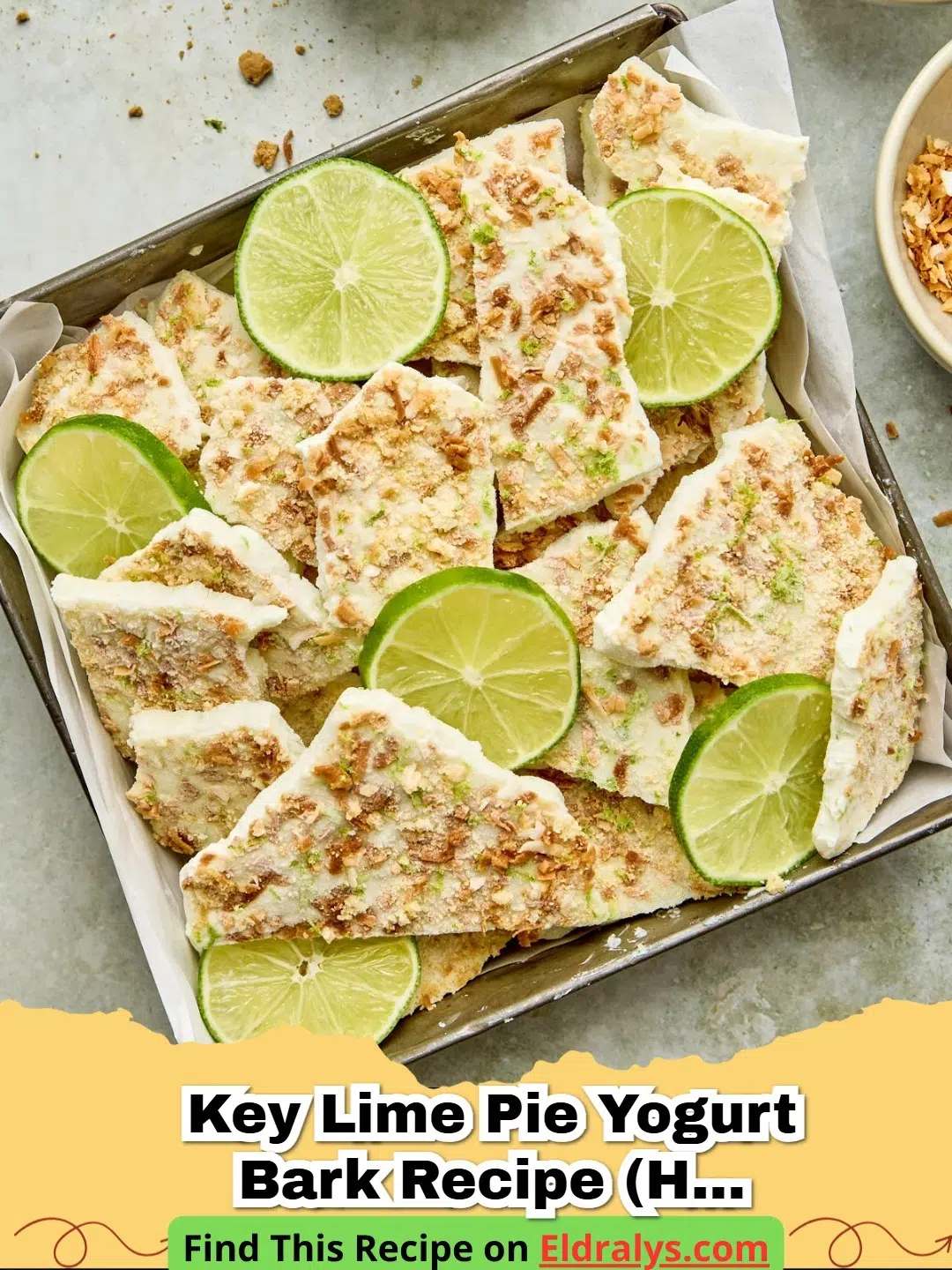 A tray of frozen Key Lime Pie Yogurt Bark Recipe (High Protein) broken into pieces.