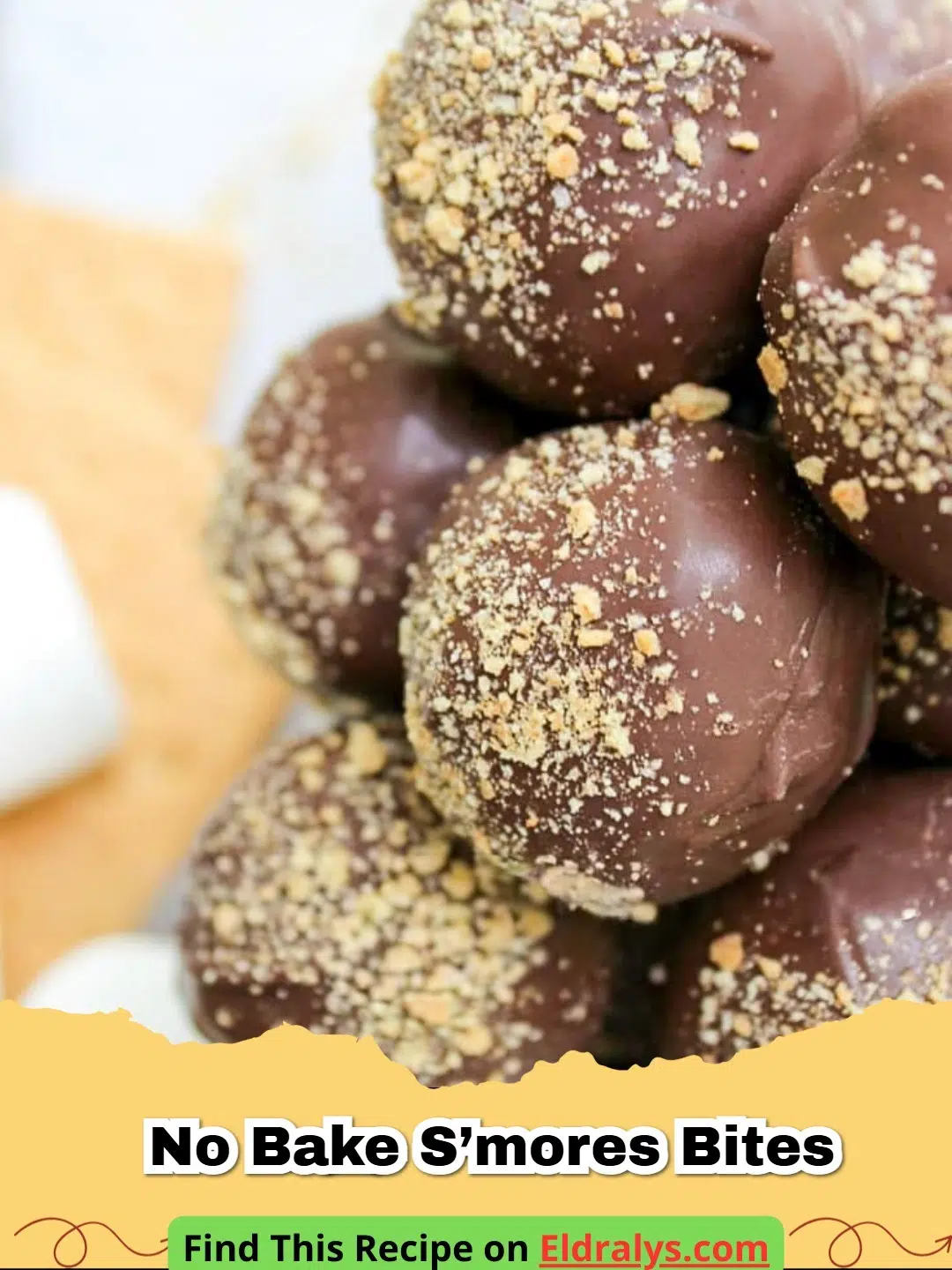 A close up shot of a platter filled with No Bake S’mores Bites showing layers of graham cracker and chocolate.
