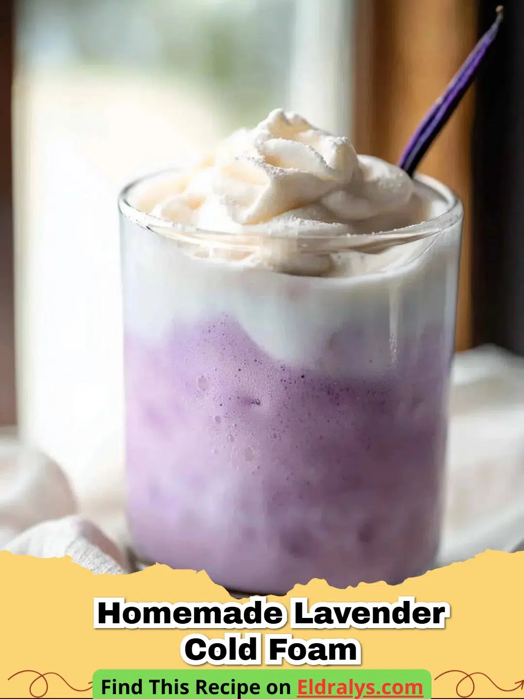 Glass of iced coffee topped with thick Homemade Lavender Cold Foam and dried lavender buds.