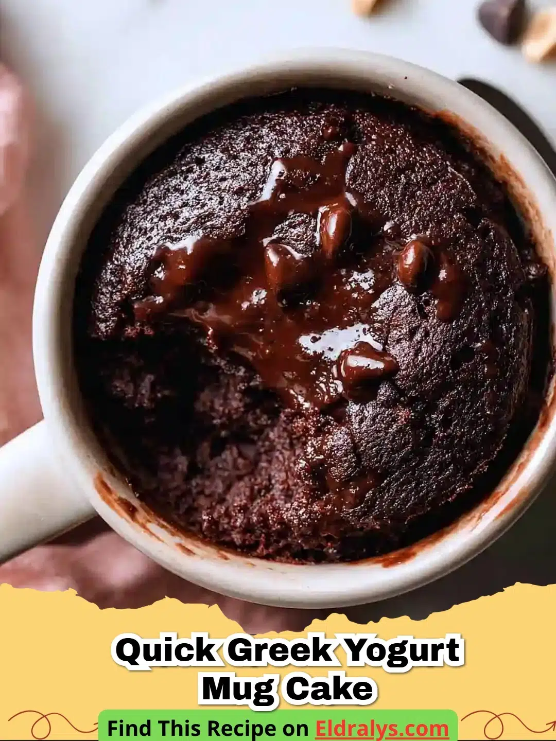 A fluffy Quick Greek Yogurt Mug Cake topped with fresh berries in a white ceramic mug.