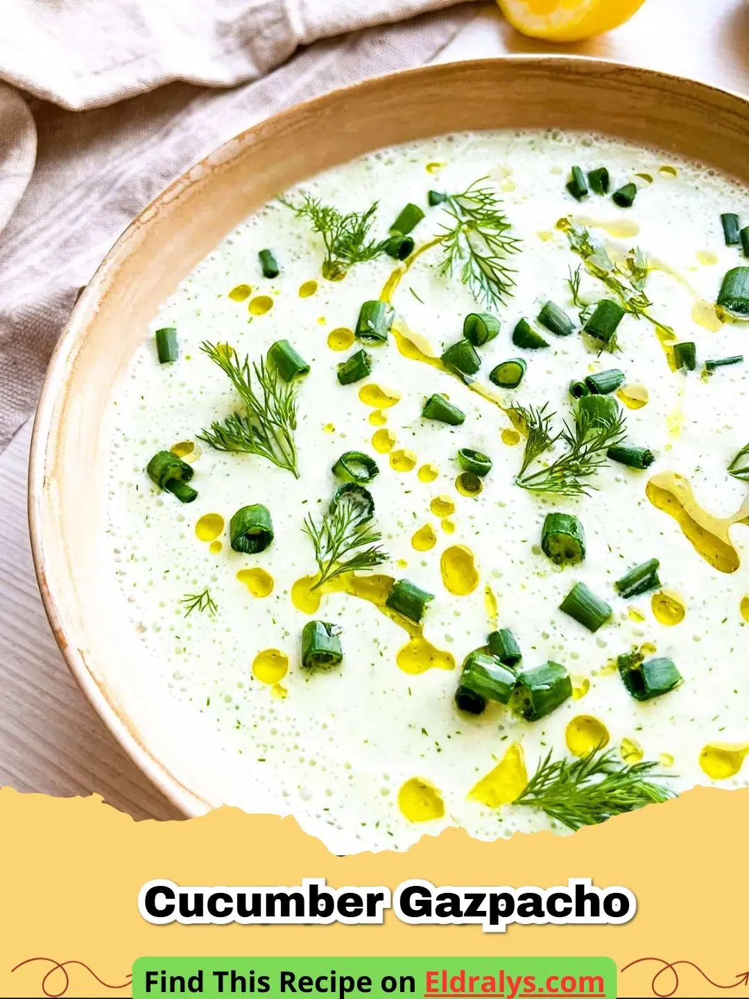 A bowl of vibrant green Cucumber Gazpacho garnished with fresh dill and olive oil