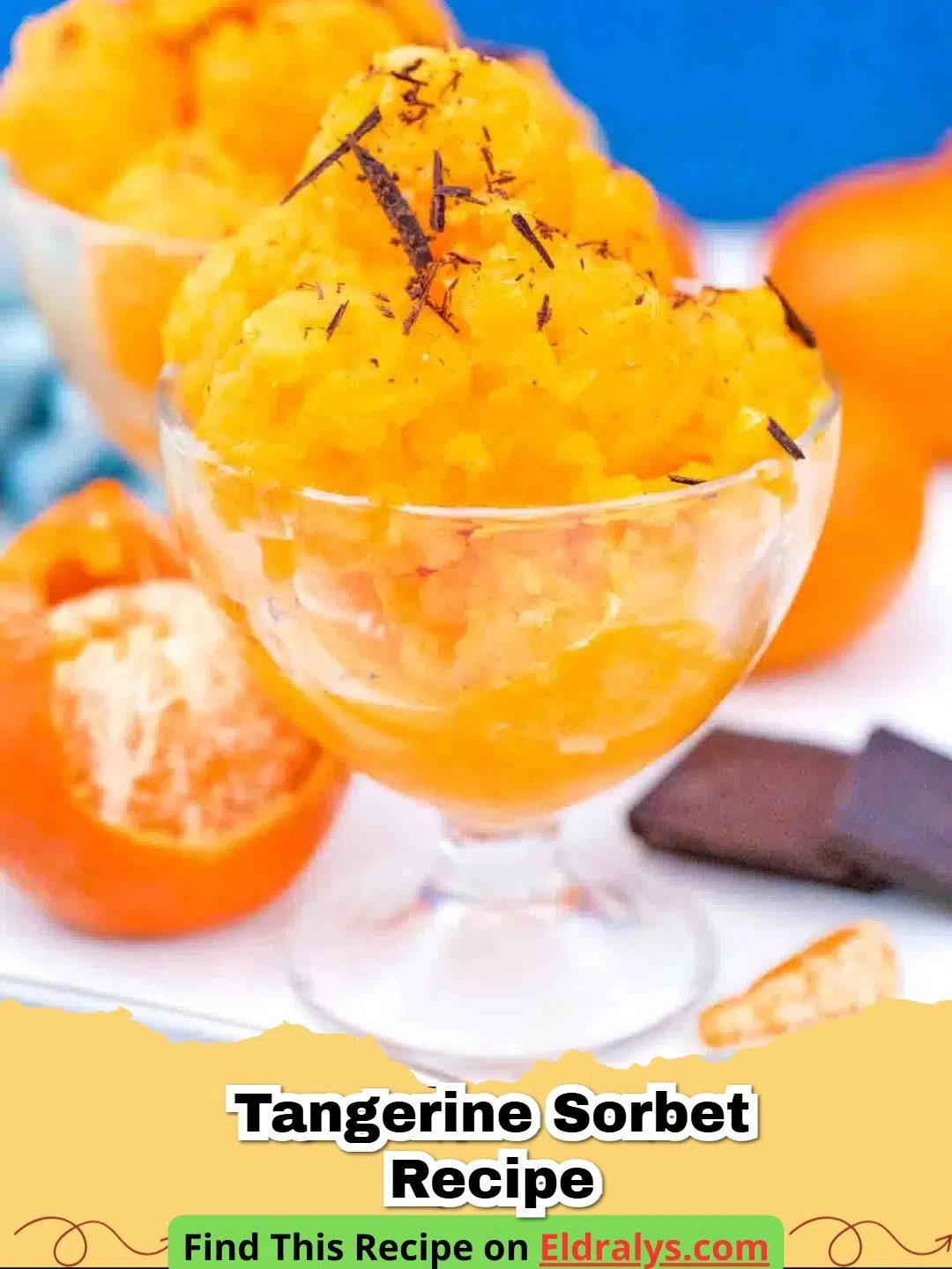 Tangerine Sorbet Recipe - A scoop of vibrant orange tangerine sorbet in a glass bowl with fresh mint