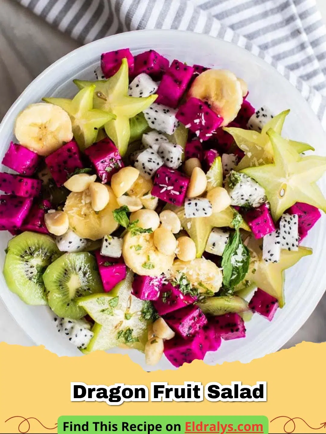 A vibrant Dragon Fruit Salad served in a dragon fruit shell with mint garnish.