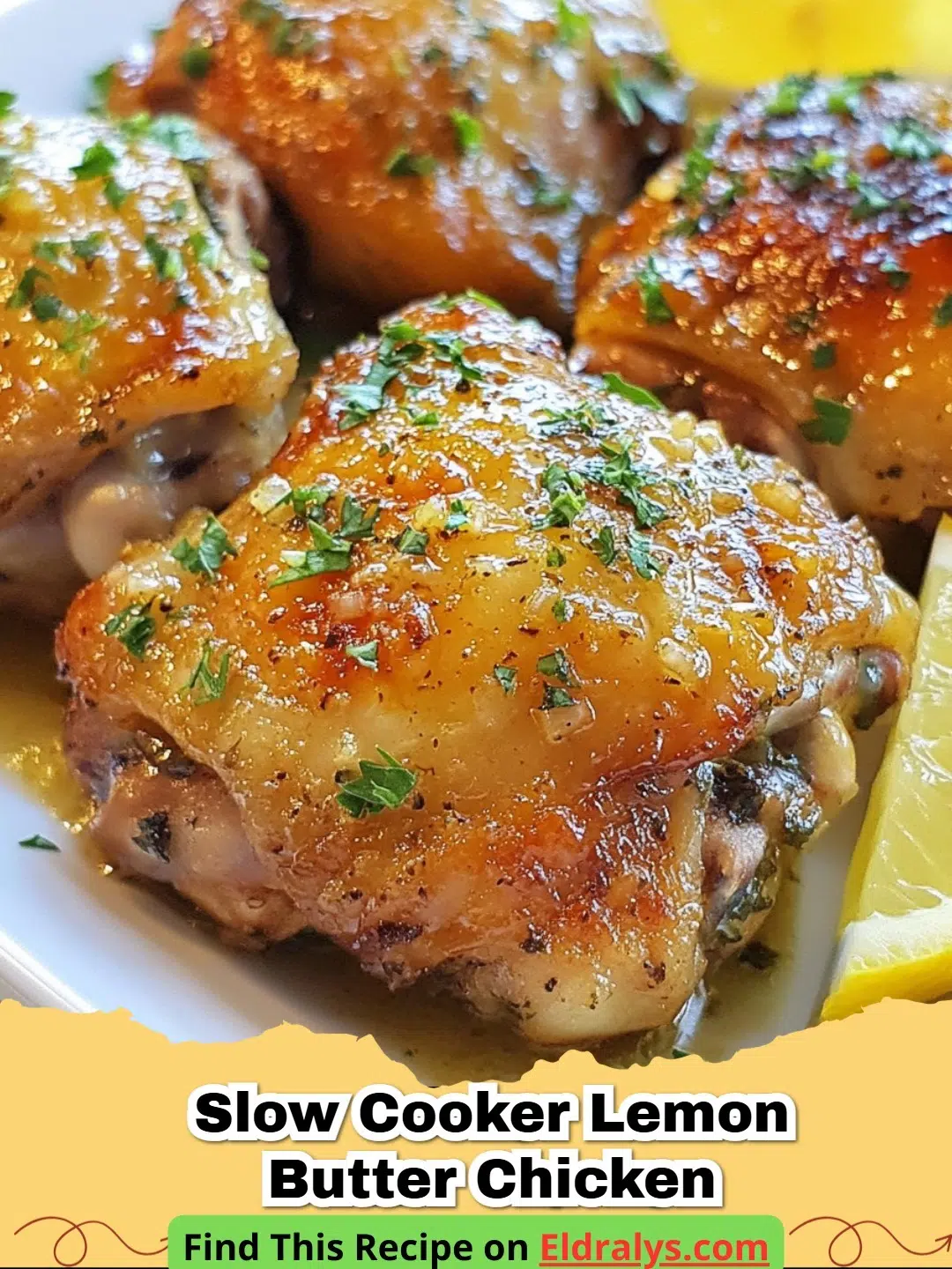 A plate of Slow Cooker Lemon Butter Chicken garnished with fresh parsley and lemon slices.