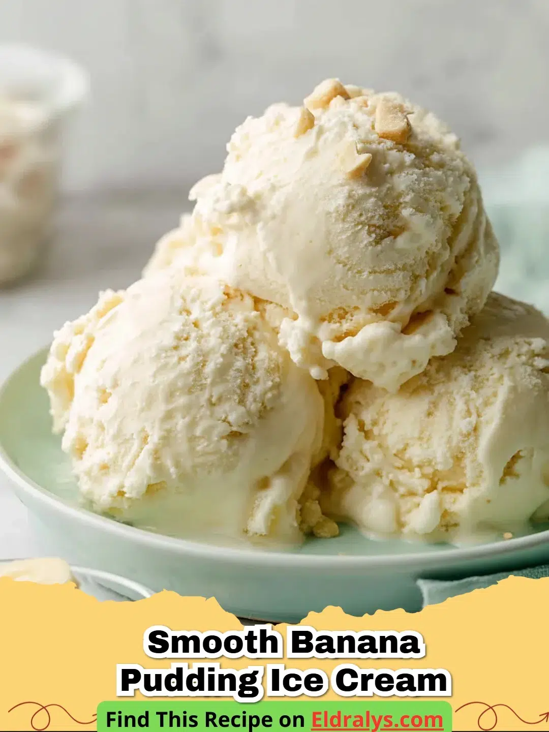 A scoop of creamy Smooth Banana Pudding Ice Cream topped with a vanilla wafer.