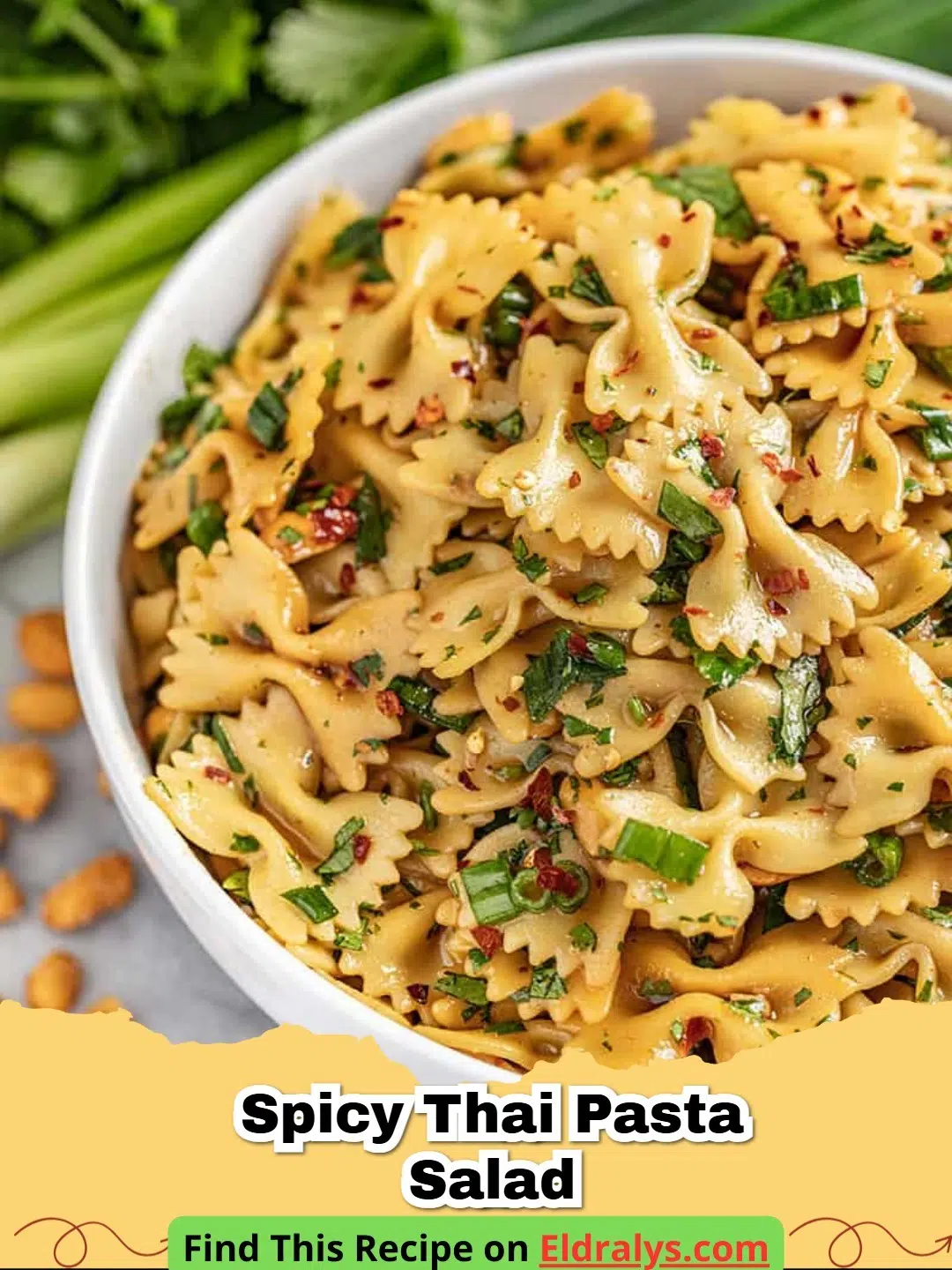 A close up view of a Spicy Thai Pasta Salad with creamy peanut dressing and red bell peppers.