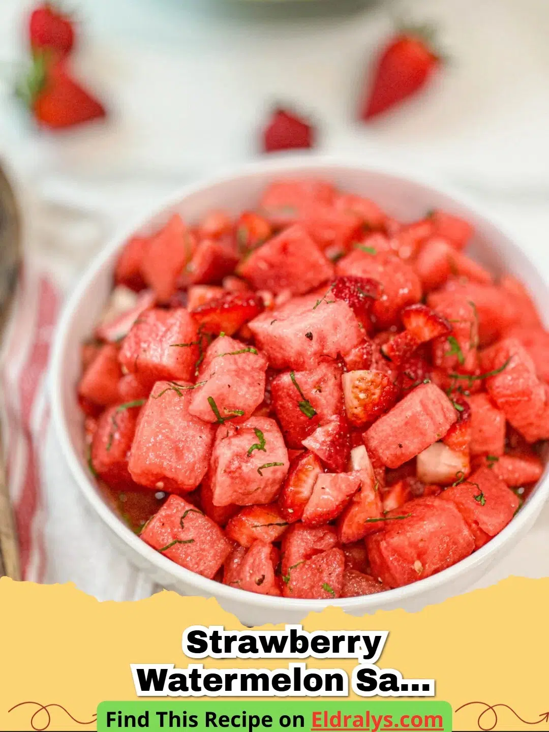 A vibrant Strawberry Watermelon Salad with Honey Lime Vinaigrette and mint garnish