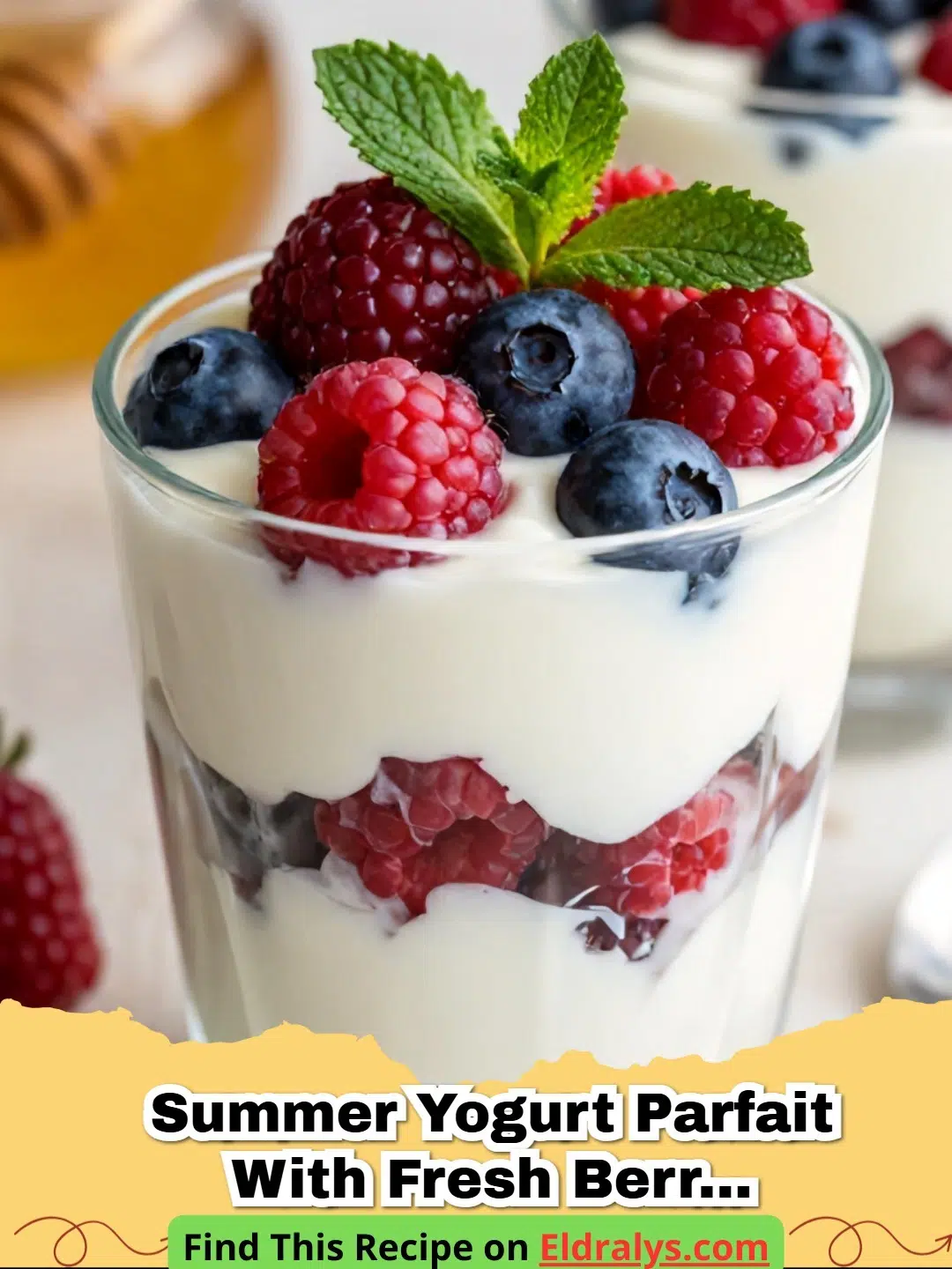 A Summer Yogurt Parfait with Fresh Berries and Honey layered in a glass jar