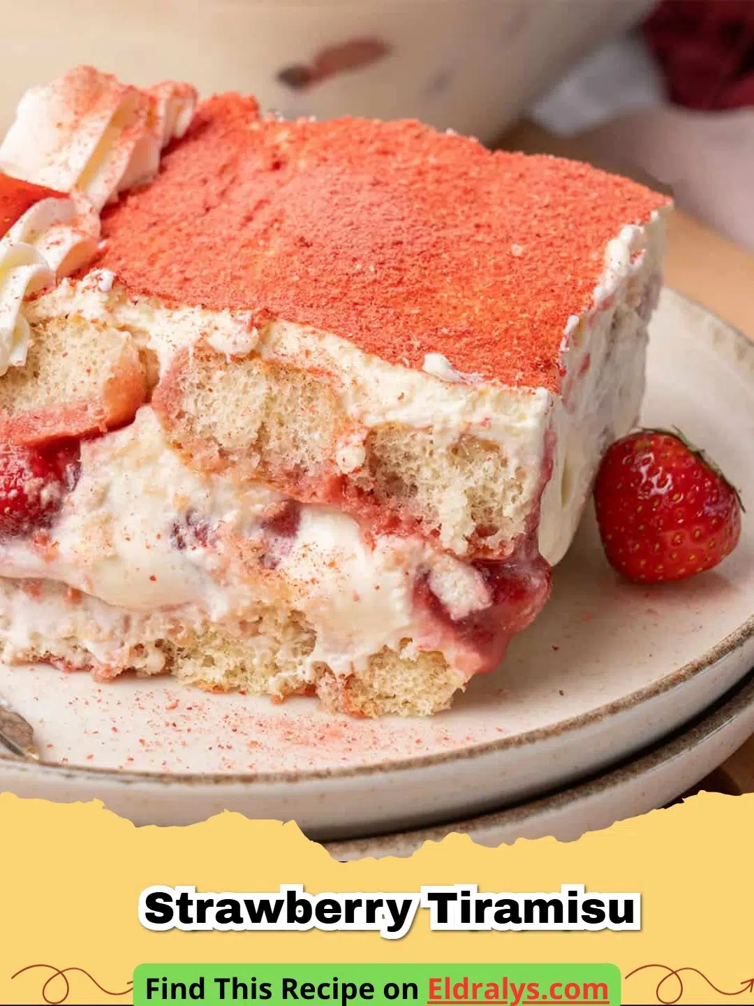 A close up of a slice of Strawberry Tiramisu showing layers of ladyfingers and red berries.