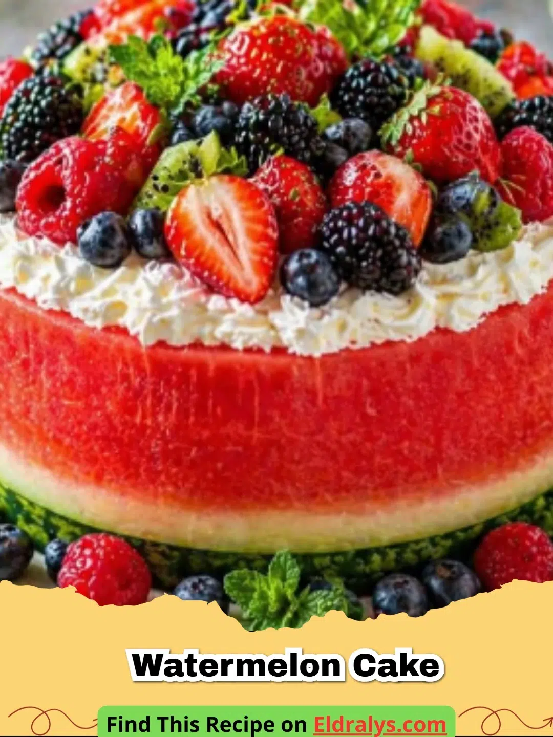 Watermelon Cake - A beautiful whole watermelon cake frosted with white whipped cream and topped with fresh strawberries and blueberries.
