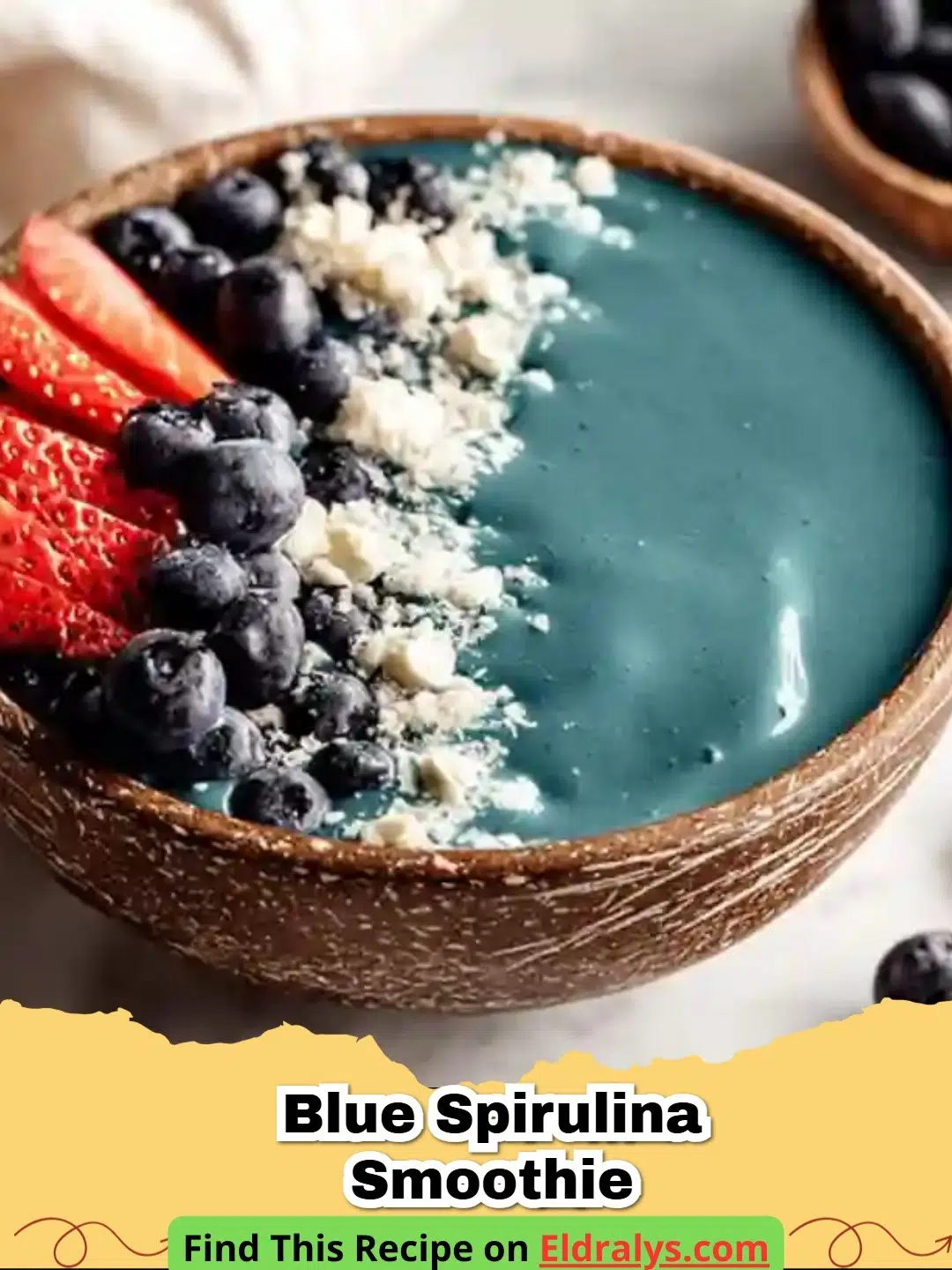 A vibrant Blue Spirulina Smoothie topped with coconut flakes and hemp seeds.