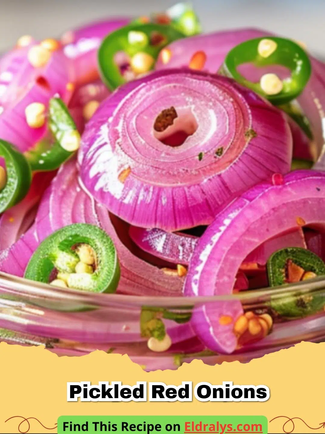 A glass jar filled with bright pink Pickled Red Onions on a kitchen counter.