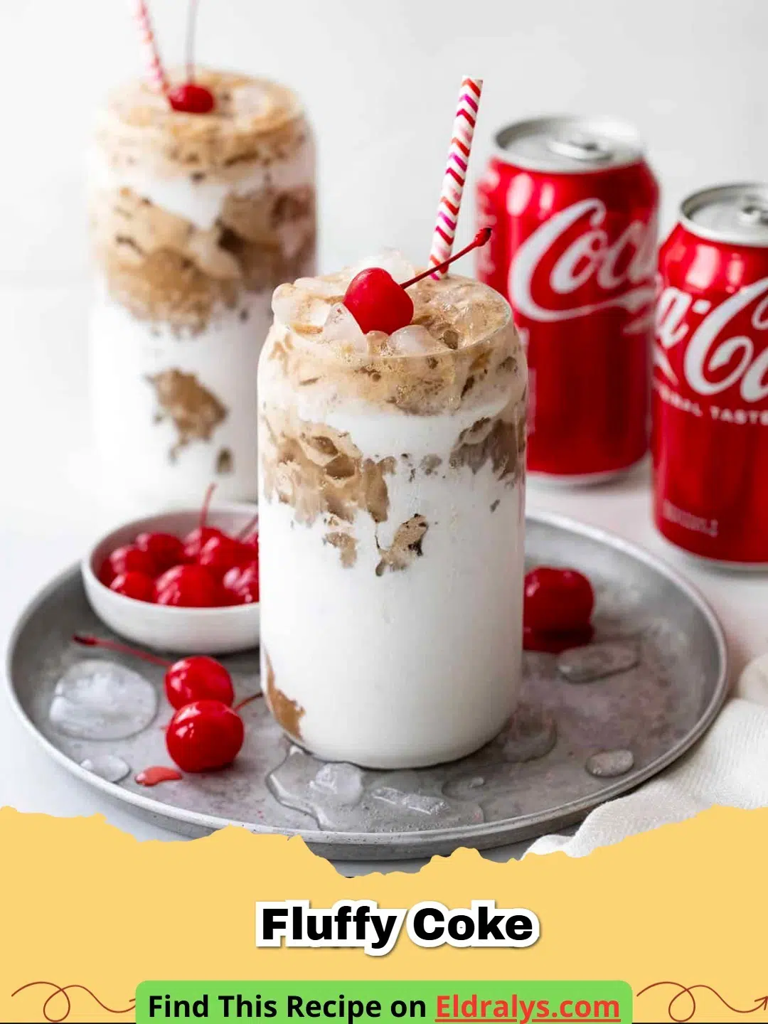 A glass of Fluffy Coke with marshmallow fluff smeared on the sides and fizzy soda.