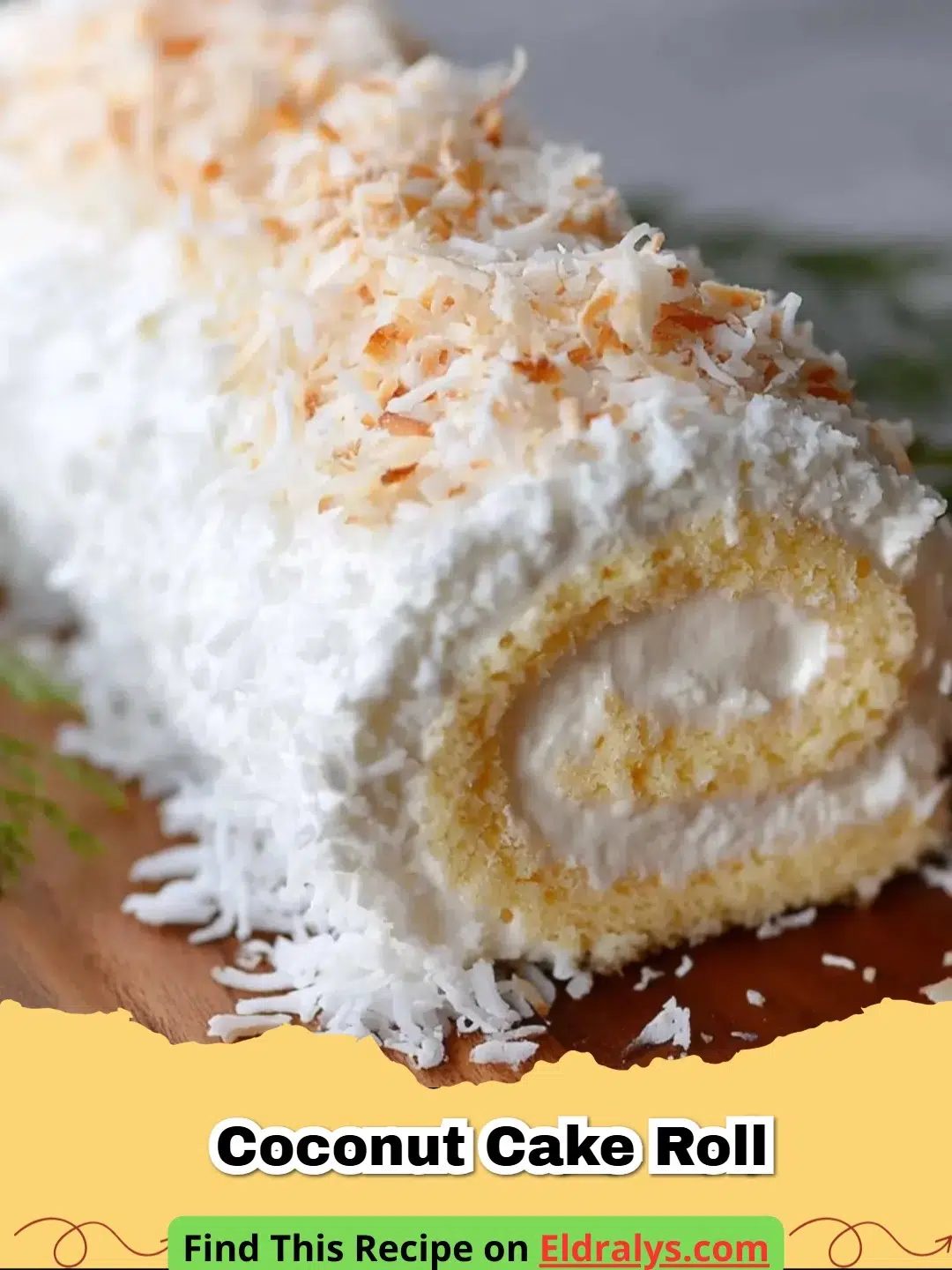 Coconut Cake Roll Recipe - A beautiful Coconut Cake Roll sliced to show the white cream spiral and garnished with shredded coconut.