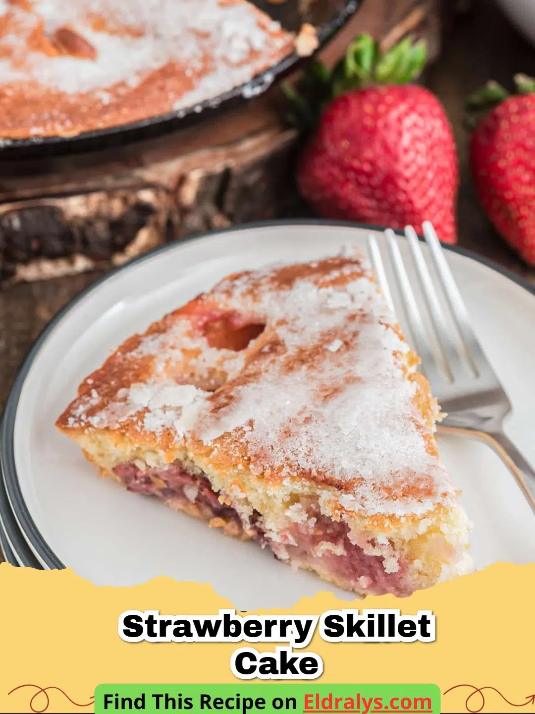 A golden brown Strawberry Skillet Cake topped with vibrant red berries in a cast iron pan.