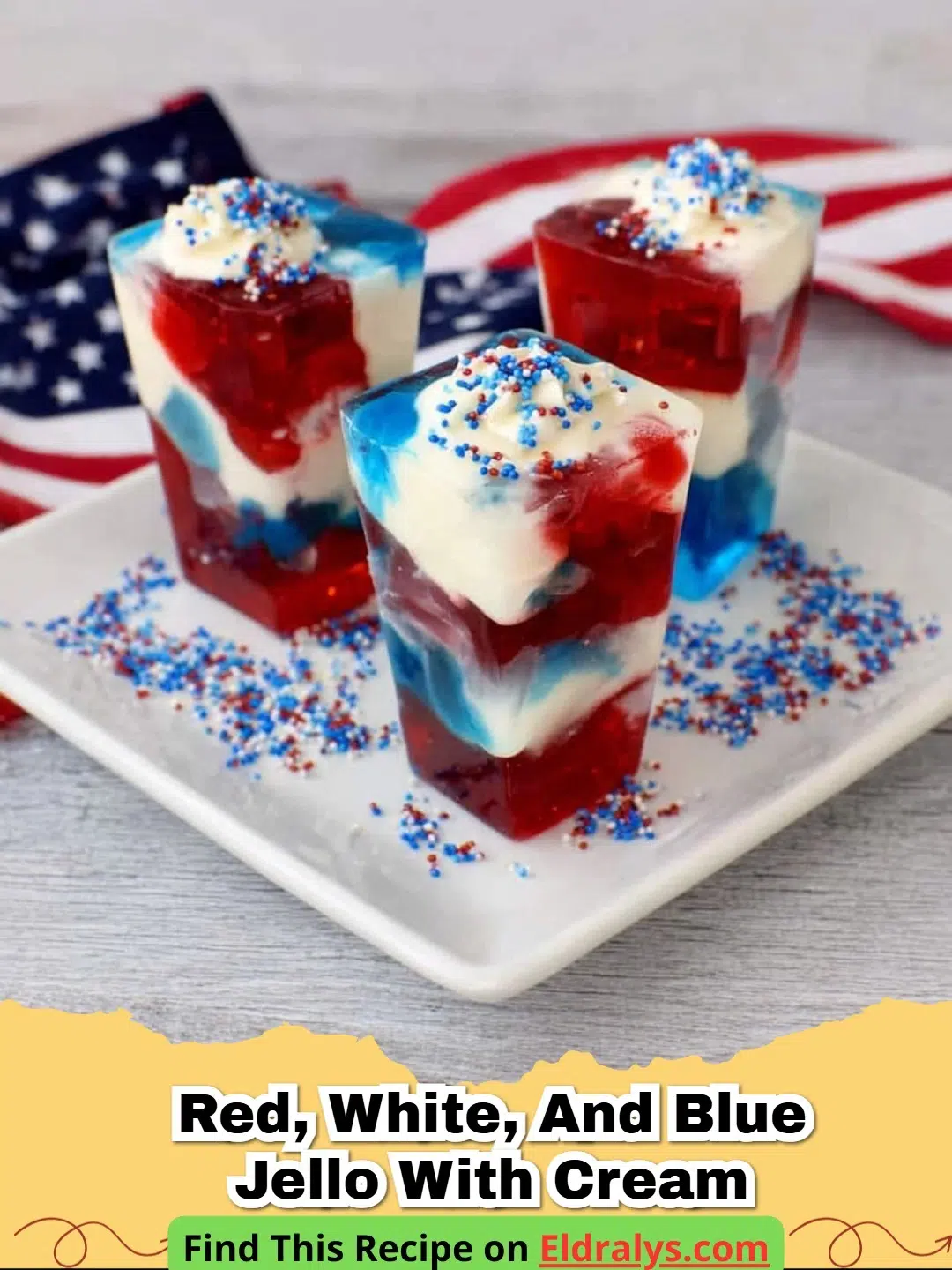 A close-up of Red, White, and Blue Jello with Cream cut into perfect squares showing distinct layers.